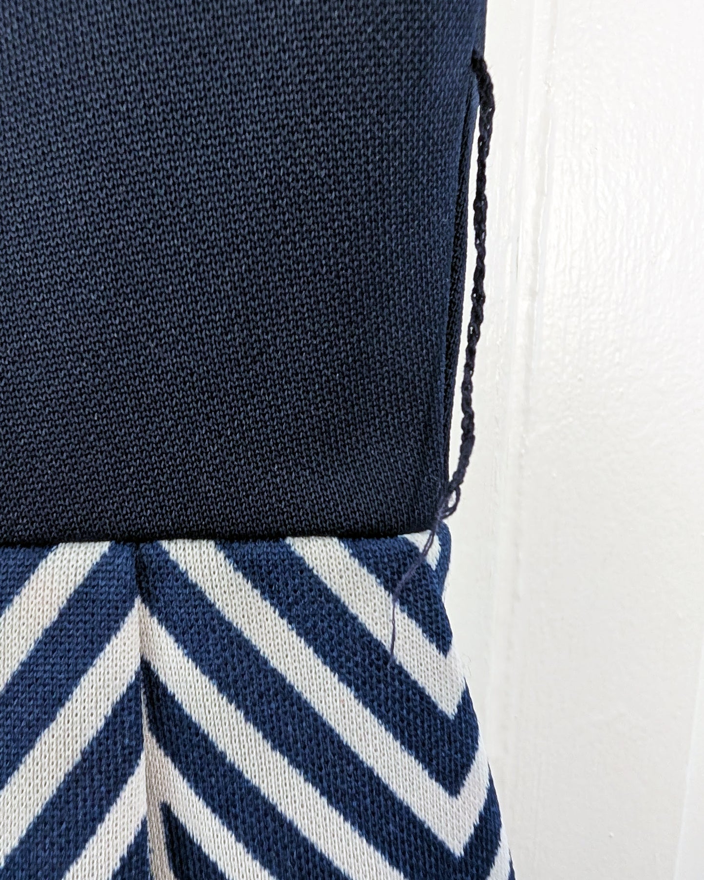 close up of the left side belt loop that has become detached