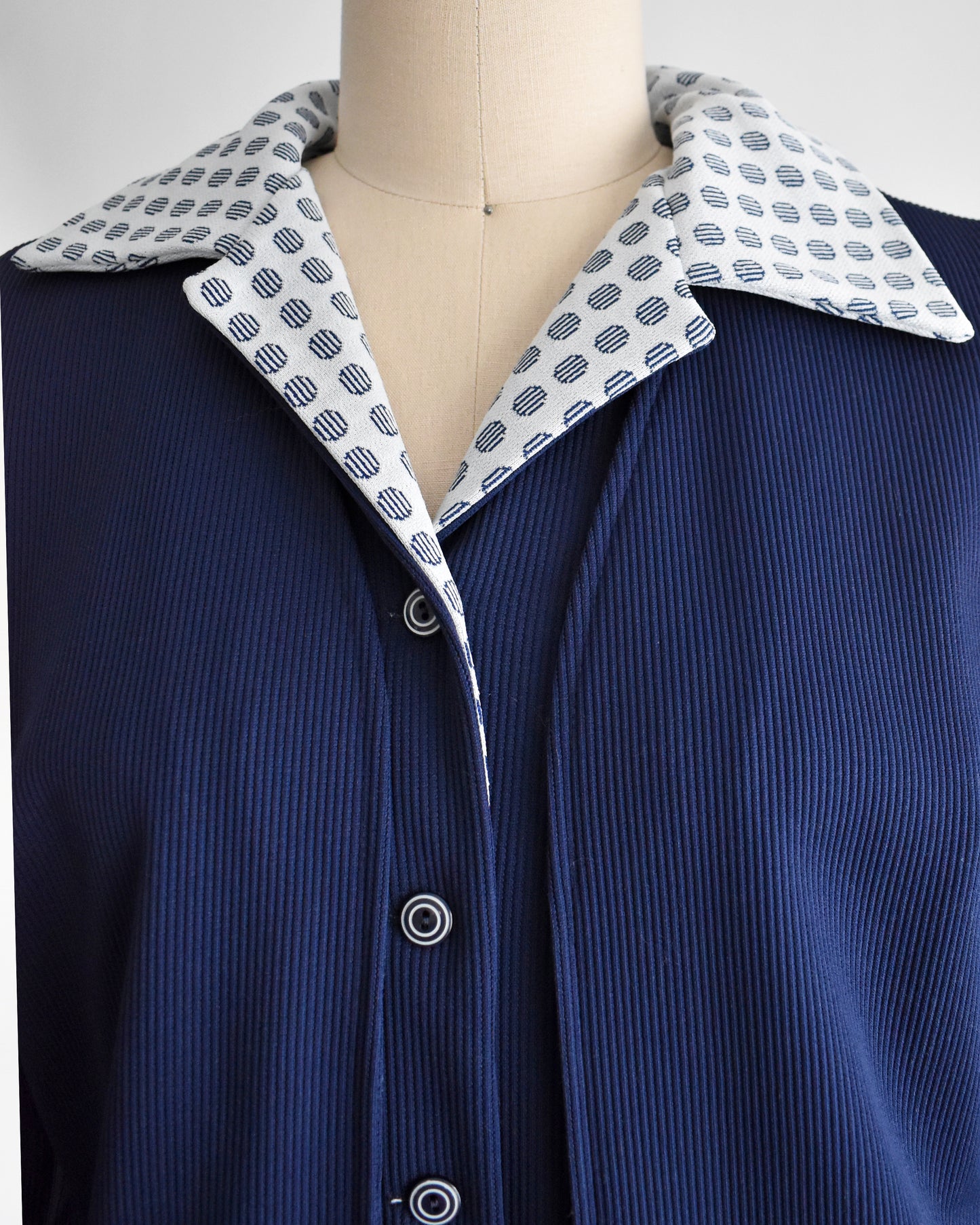 close up of the button up front and collar on the dress