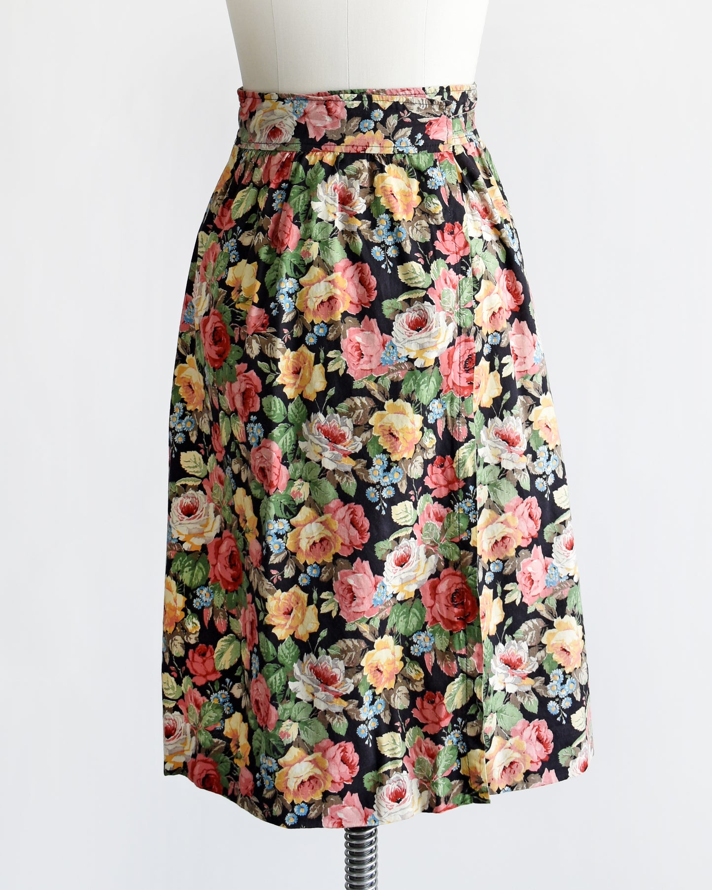 back view of a vintage 1970s black floral wrap skirt