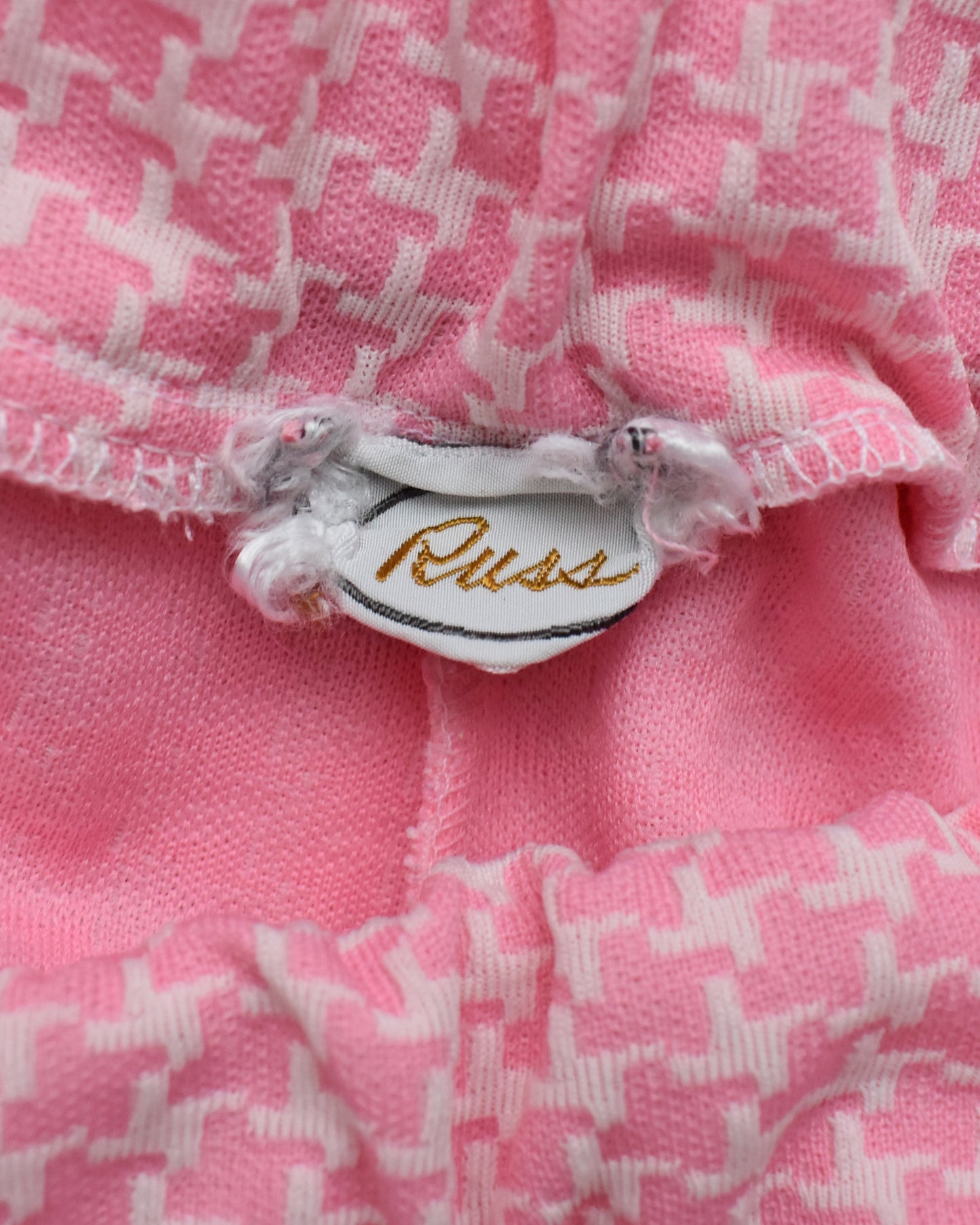 Close up of the tag which says Russ