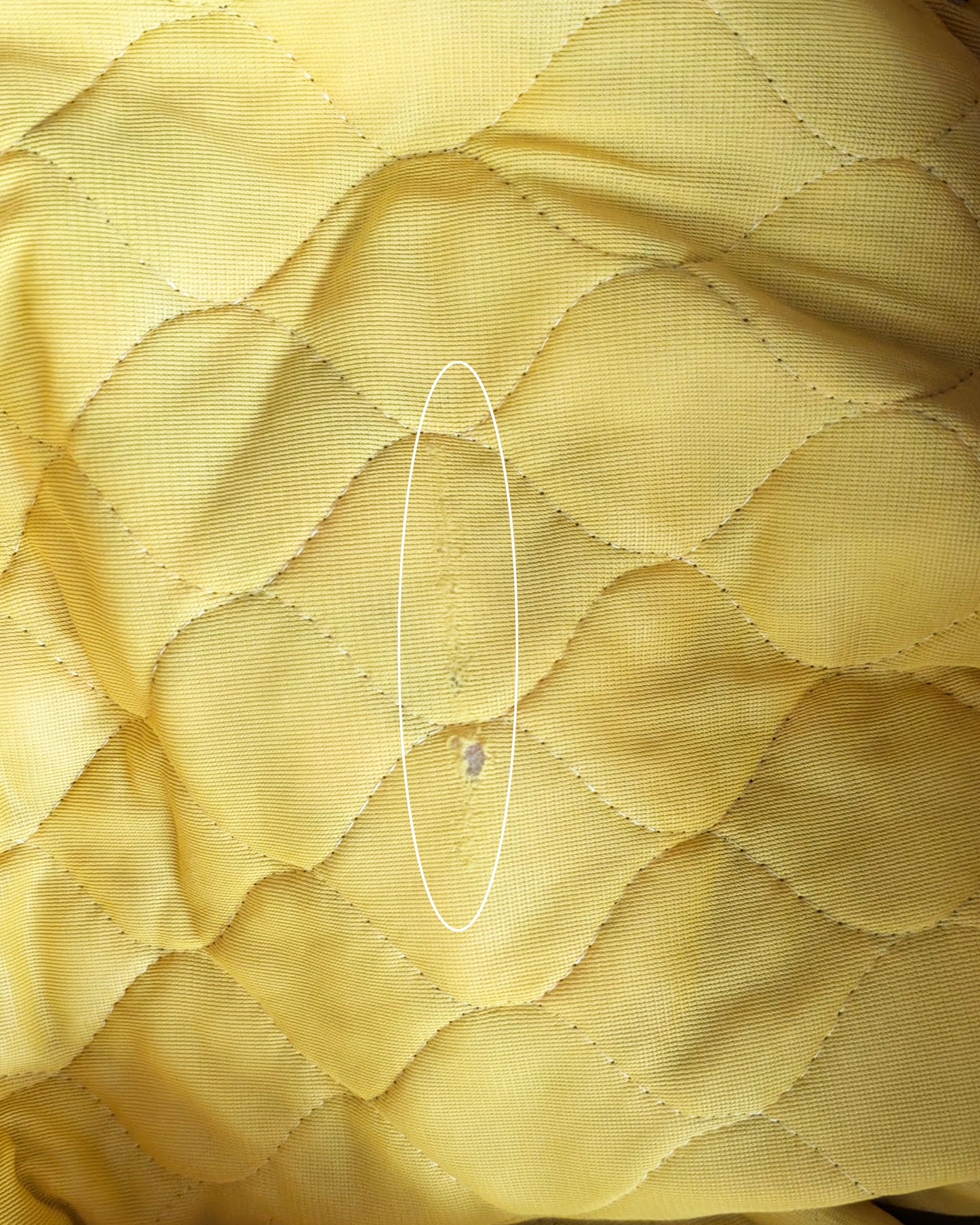 close up of a small hole and run on the inside of the skirt