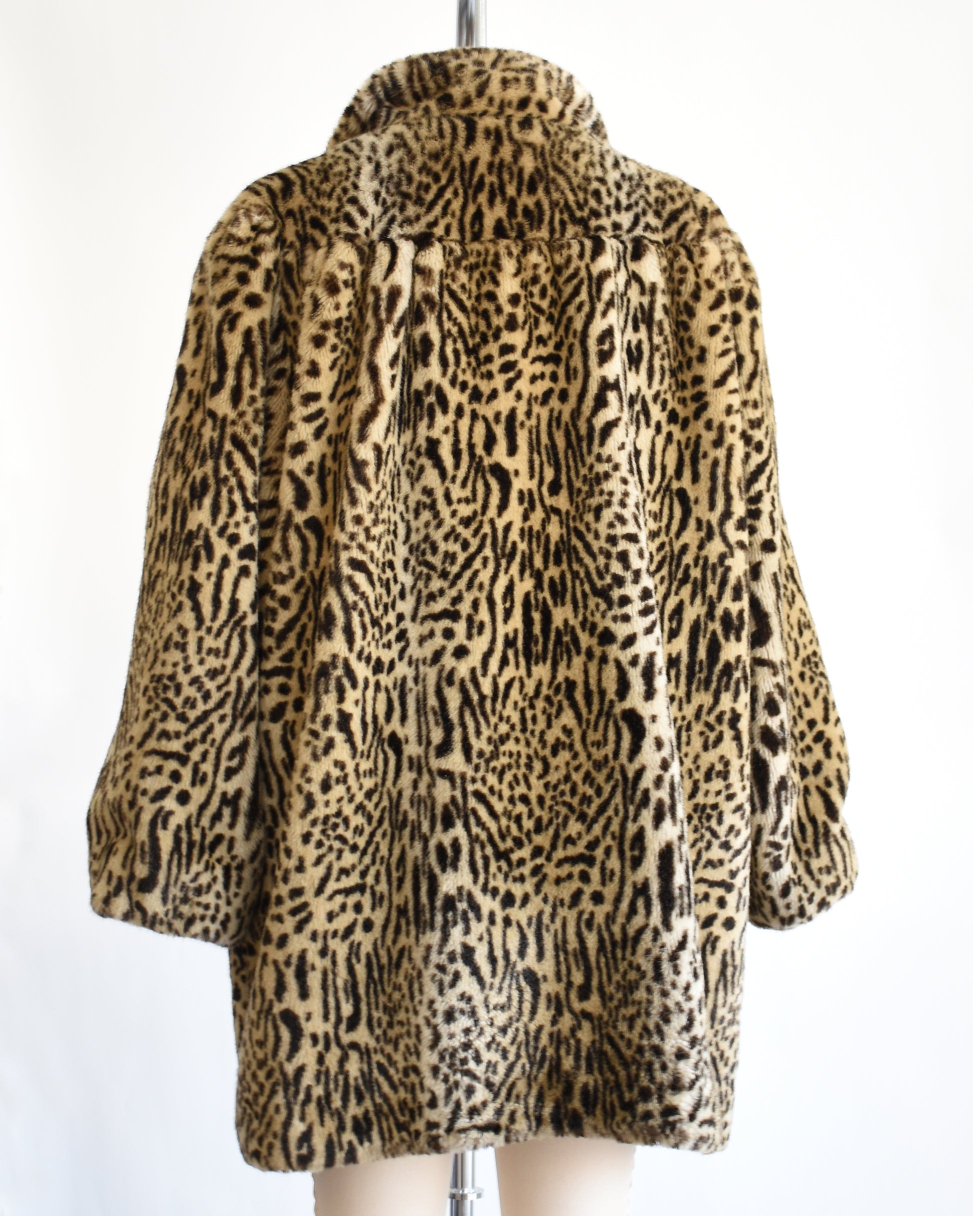 back view of a vintage 1970s faux fur leopard print coat