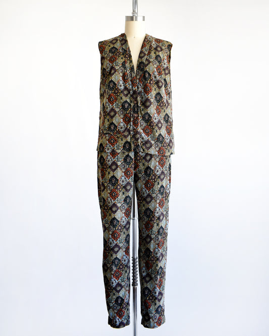 a vintage 1960s floral patterned vest and pants set on a mannequin against a white background