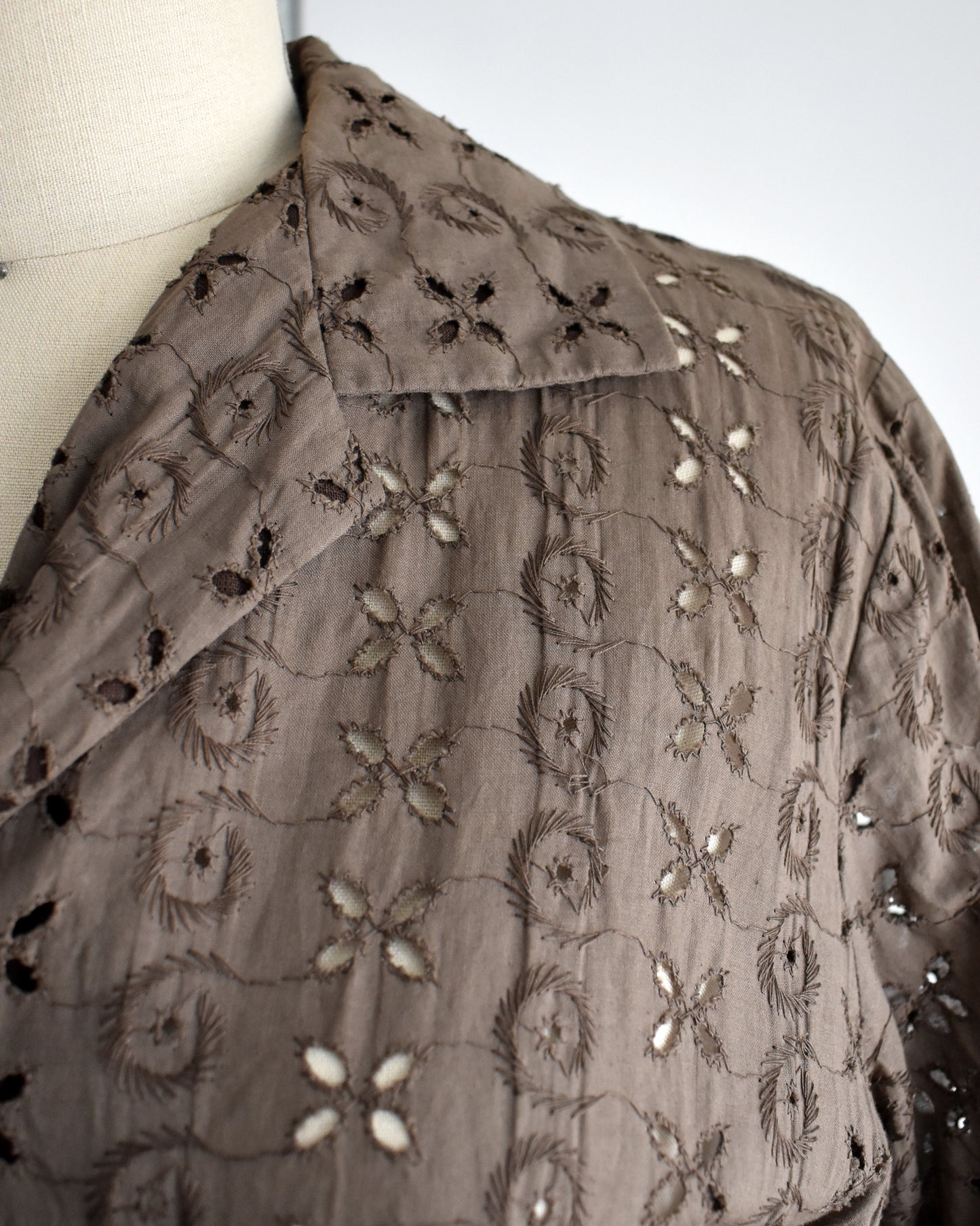 close up of the eyelet embroidered detail on the bodice of the dress
