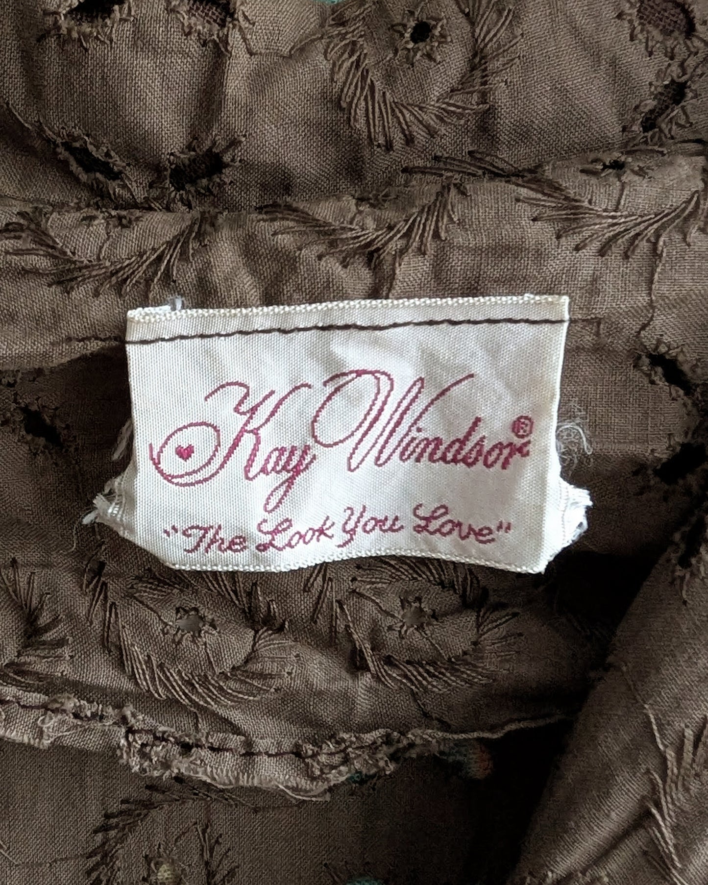 a close up of the tag which says Kay Windsor