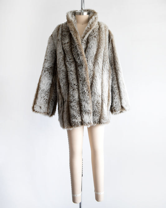 a vintage 1980s brown and gray faux fur coat on a mannequin against a white background