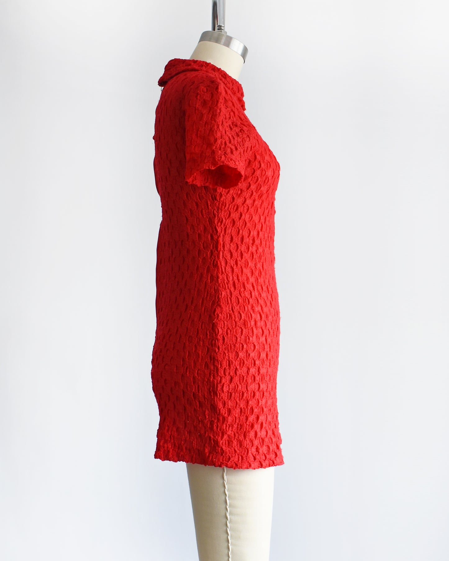 side view of a vintage late 60s early 70s red textured knit bodysuit/romper