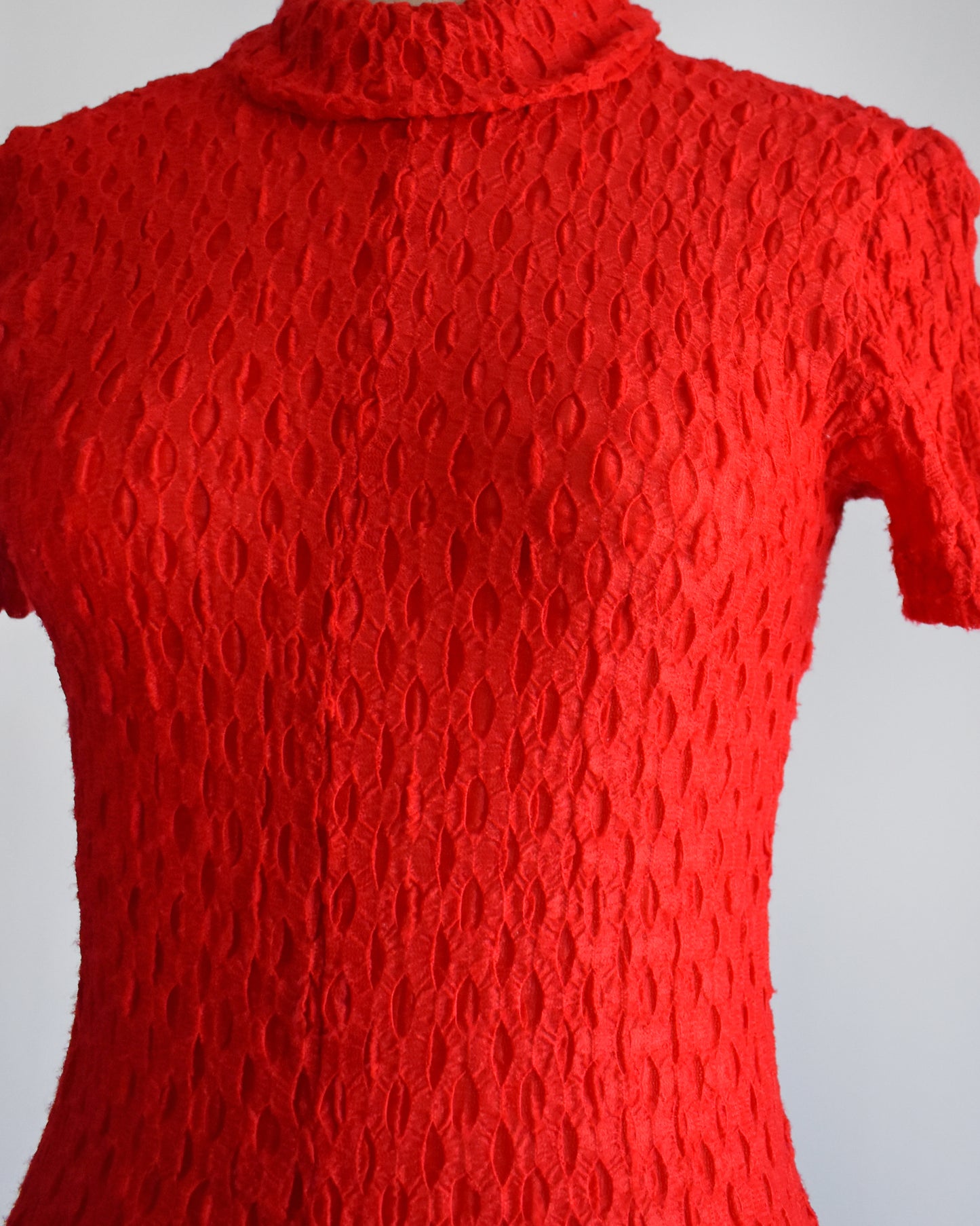 close up of the textured knit on the bodysuit/romper