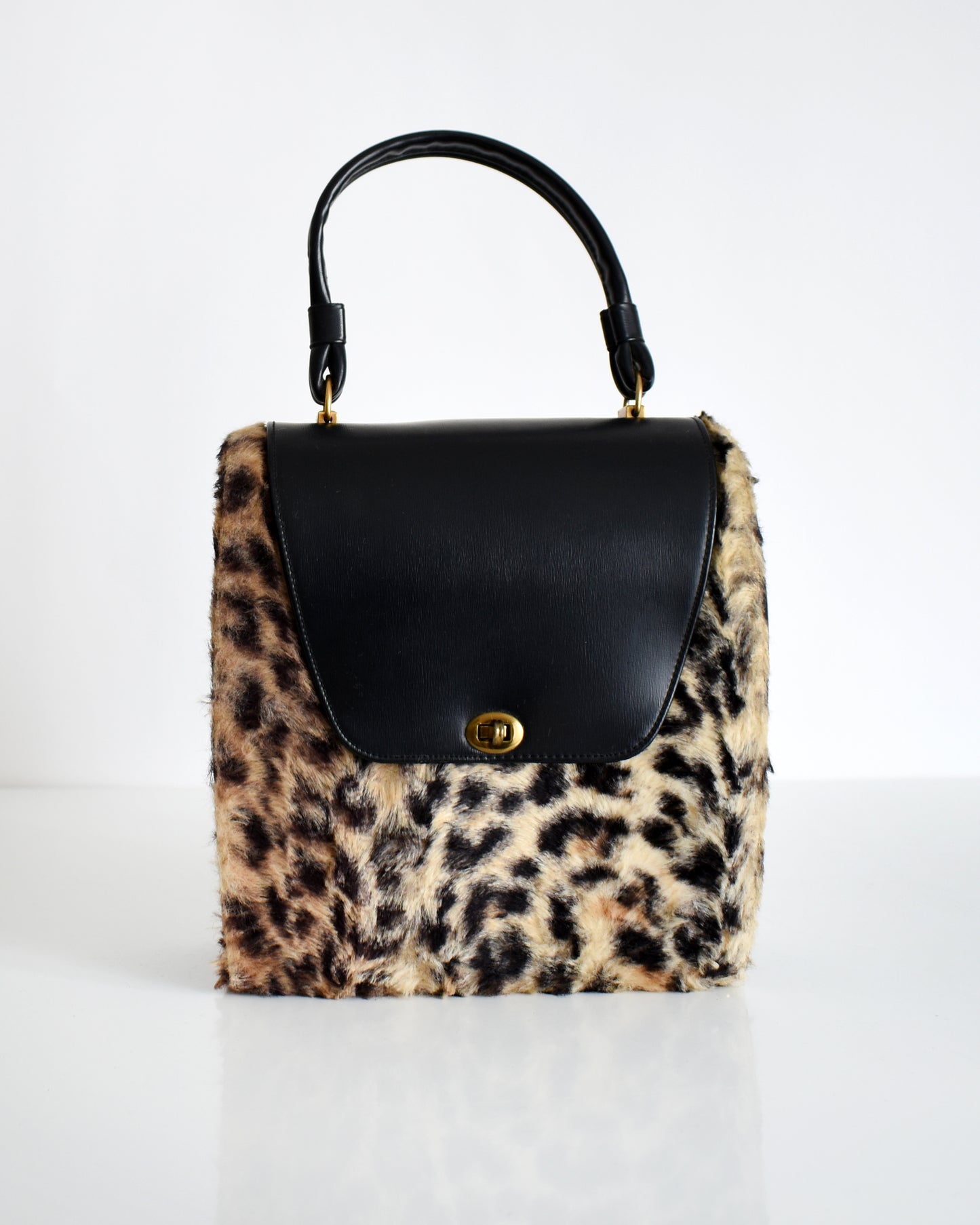 a vintage 1950s faux leopard print purse
