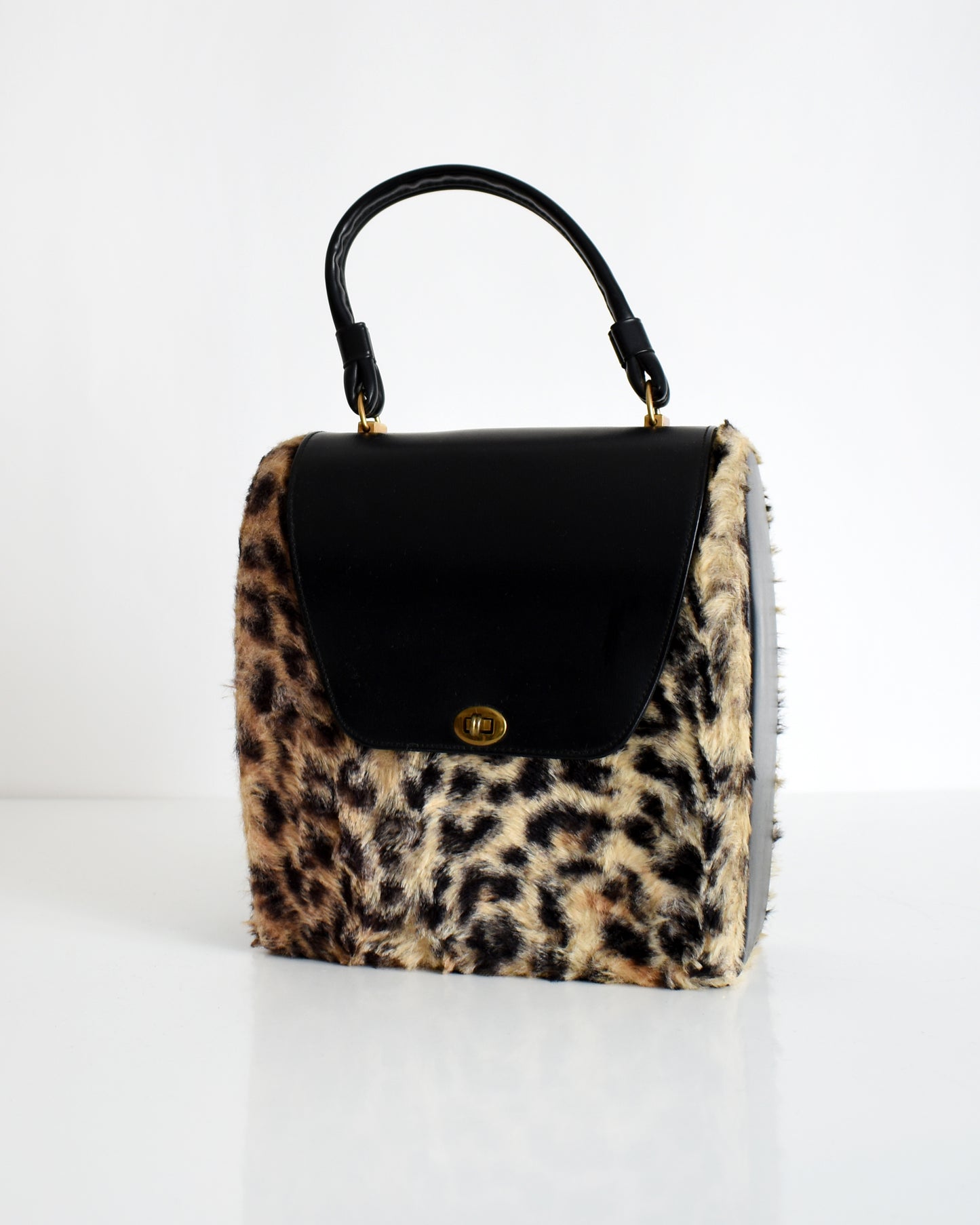 side front view of a vintage 1950s faux leopard print purse