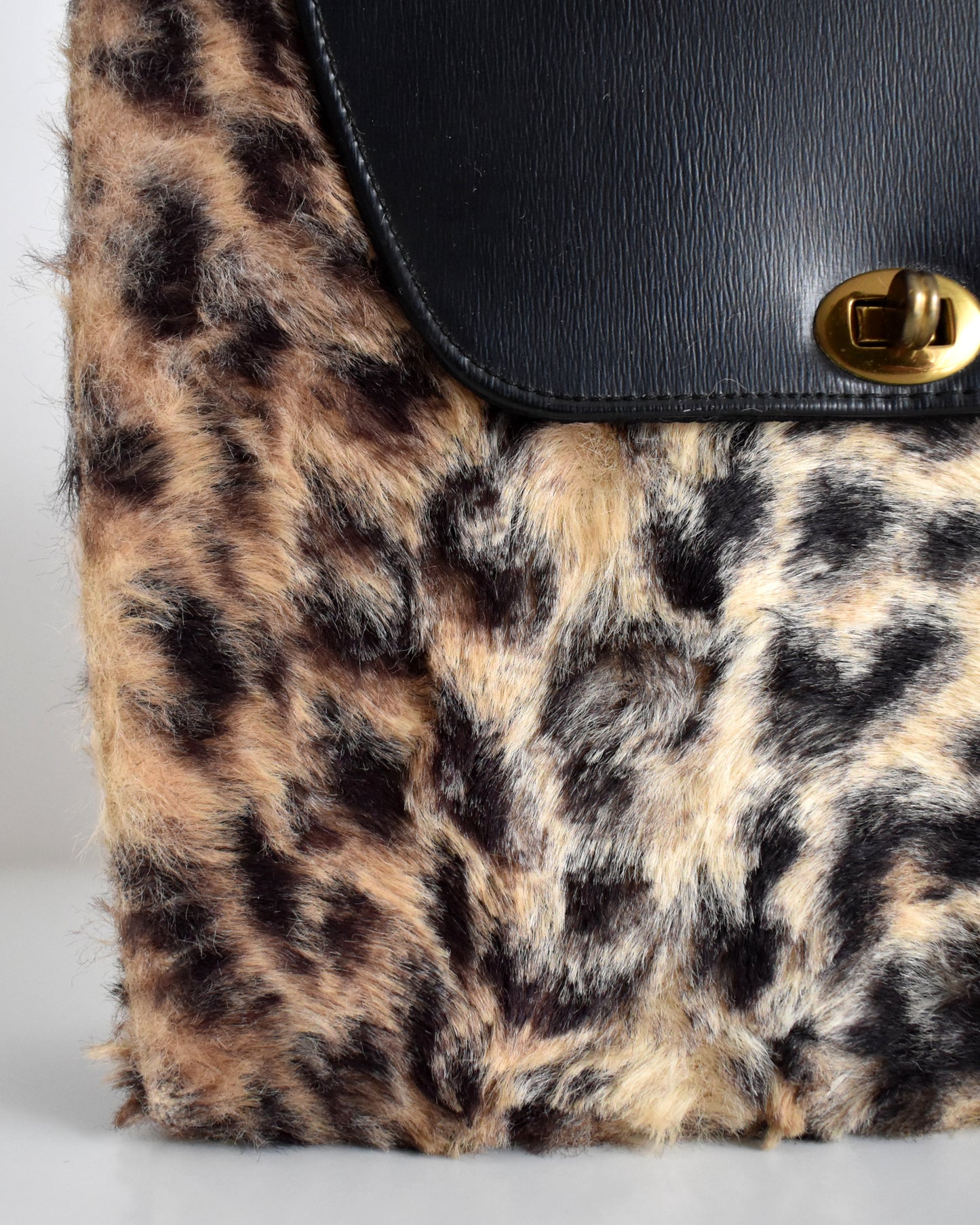 close up of the faux fur on a vintage 1950s faux leopard print purse