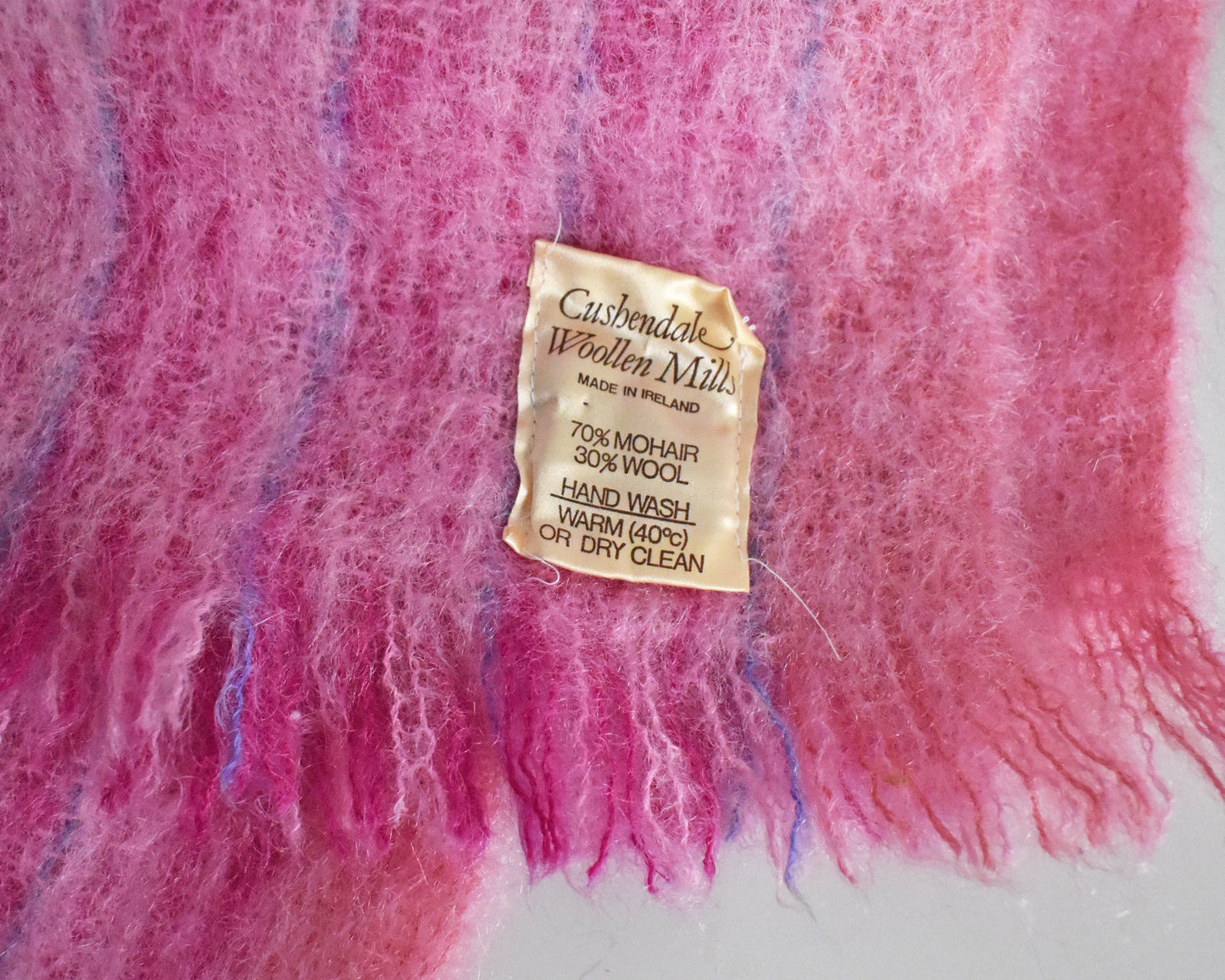 close up of the tag which says Cushendale Woolen Mills Made in Ireland 70% mohair 30% wool