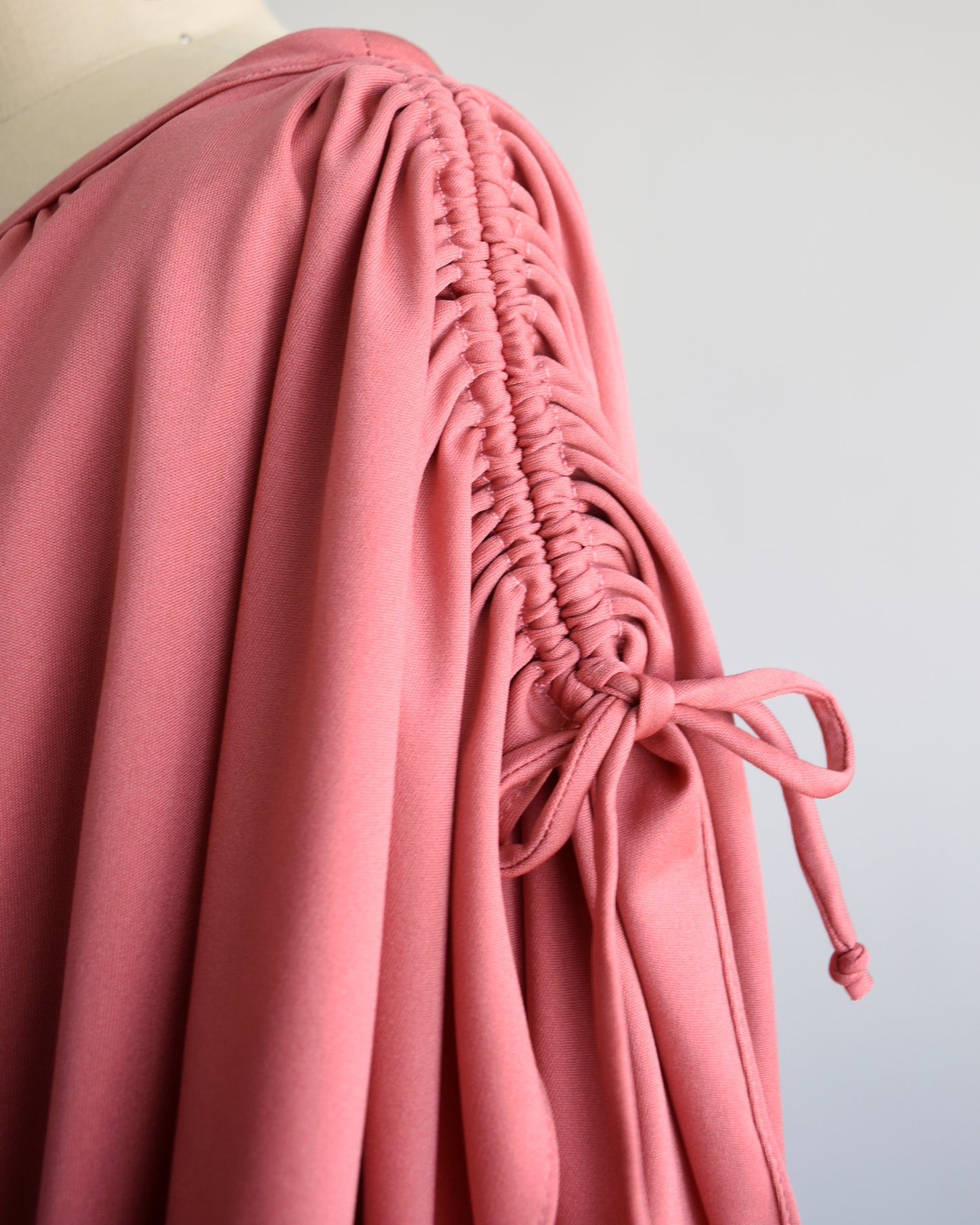 Close up of the flutter sleeves with drawstring tie at the end