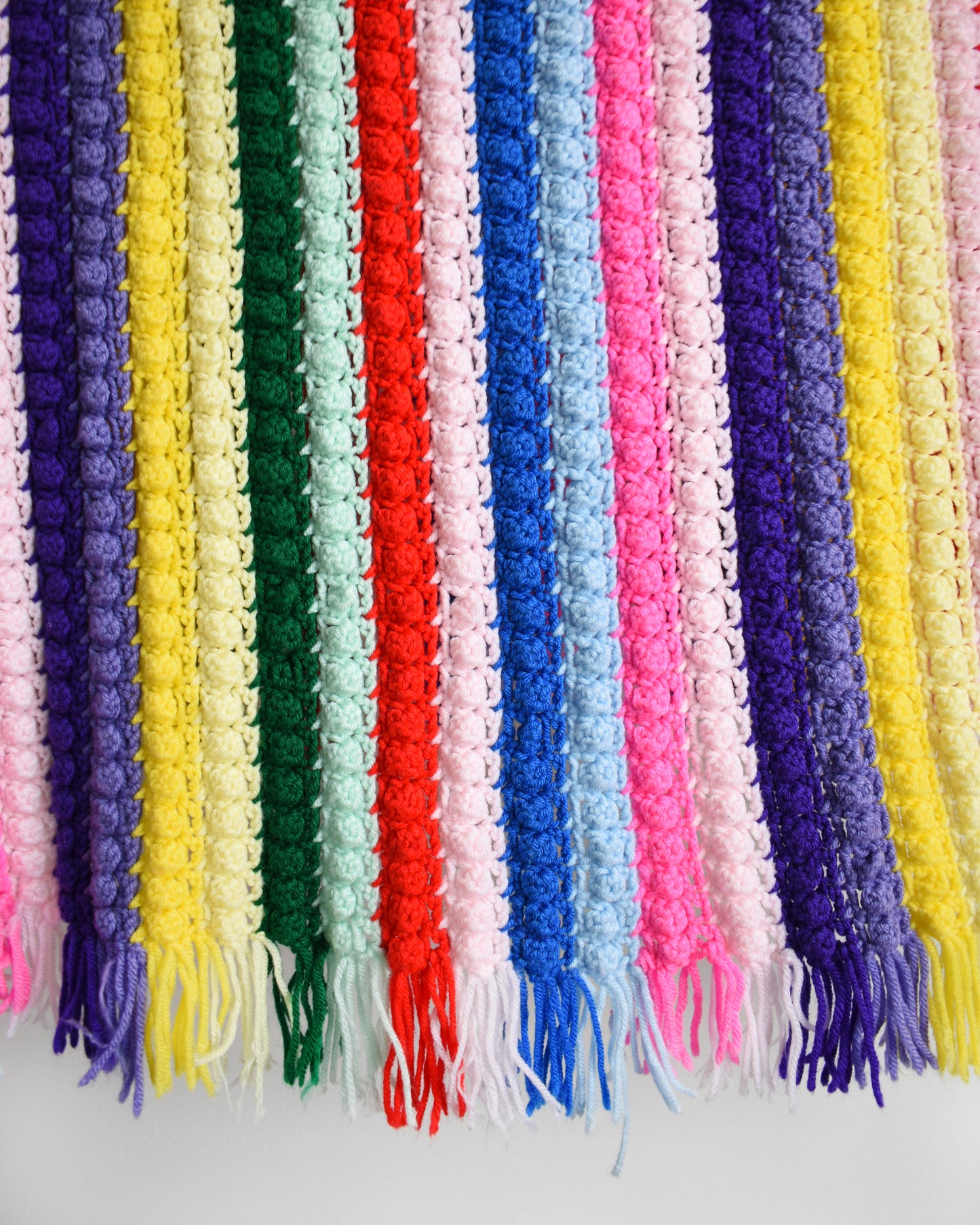 close up of a vintage rainbow striped blanket