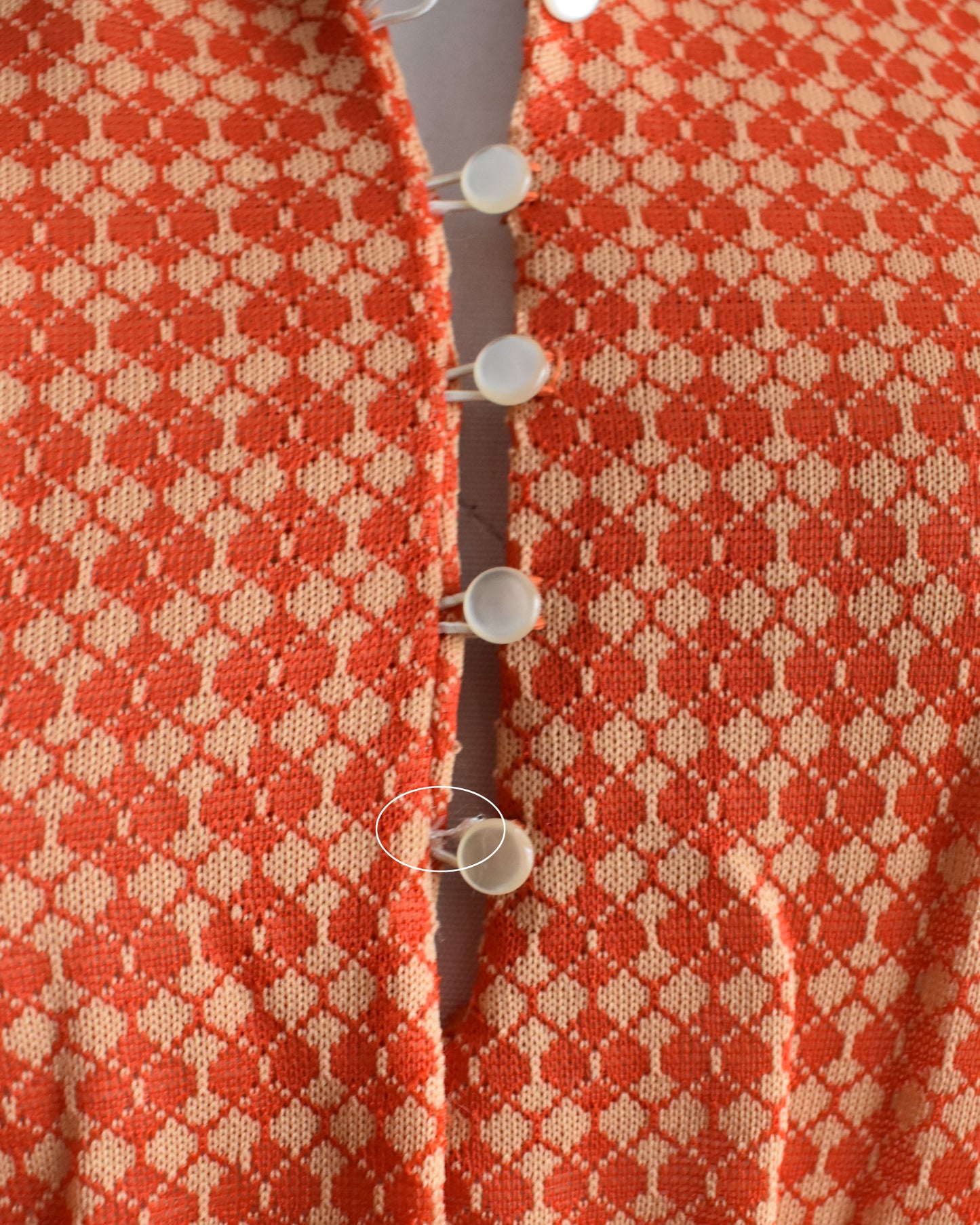 Close up of the buttons, which shows a small flaw on the last button loop which has unraveled a bit