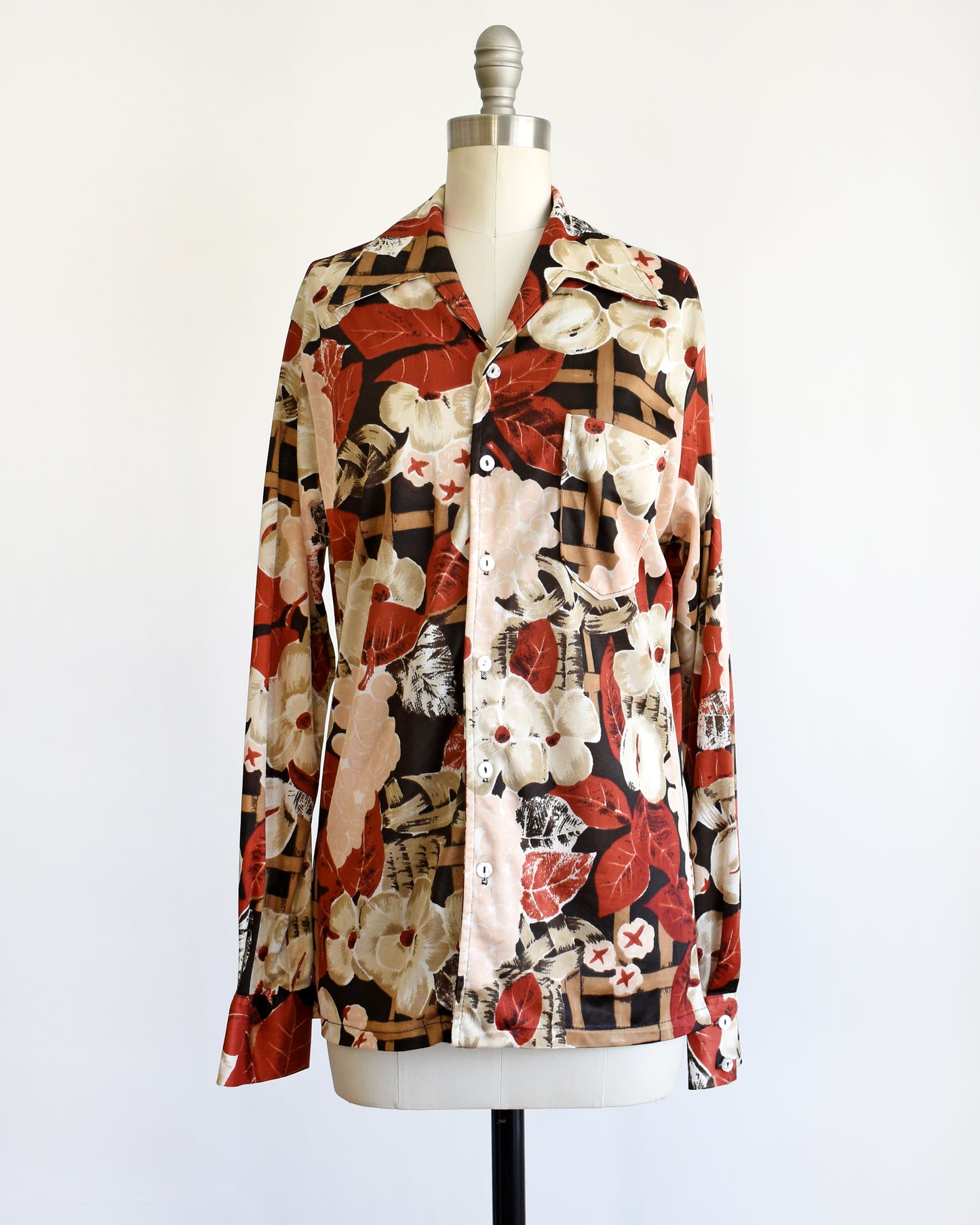 a vintage 1970s fruit and florals disco shirt on a dress form