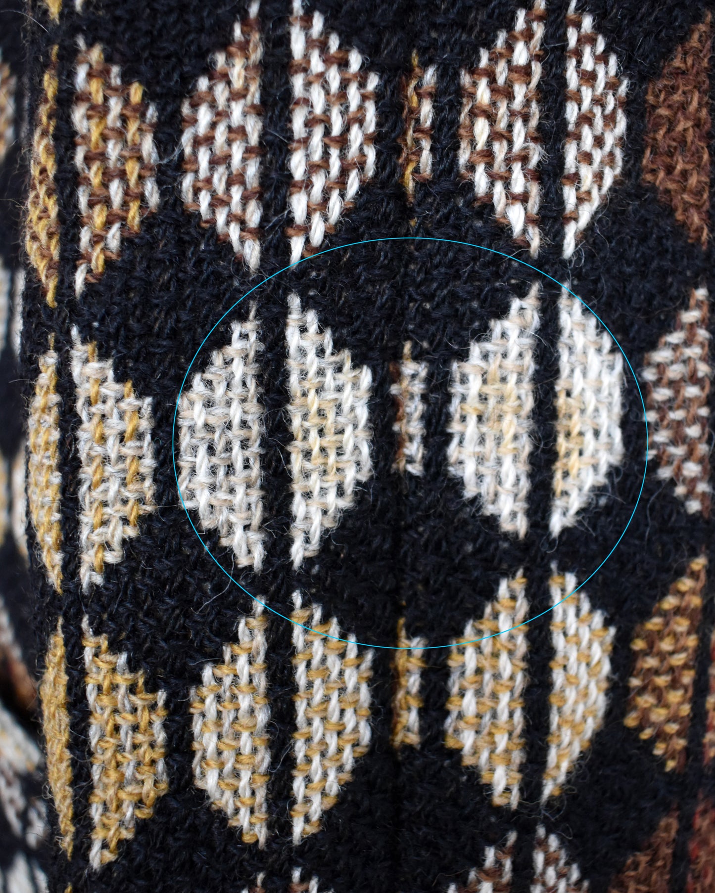 Close-up of the sleeve which has a slight discolored spot which is circled