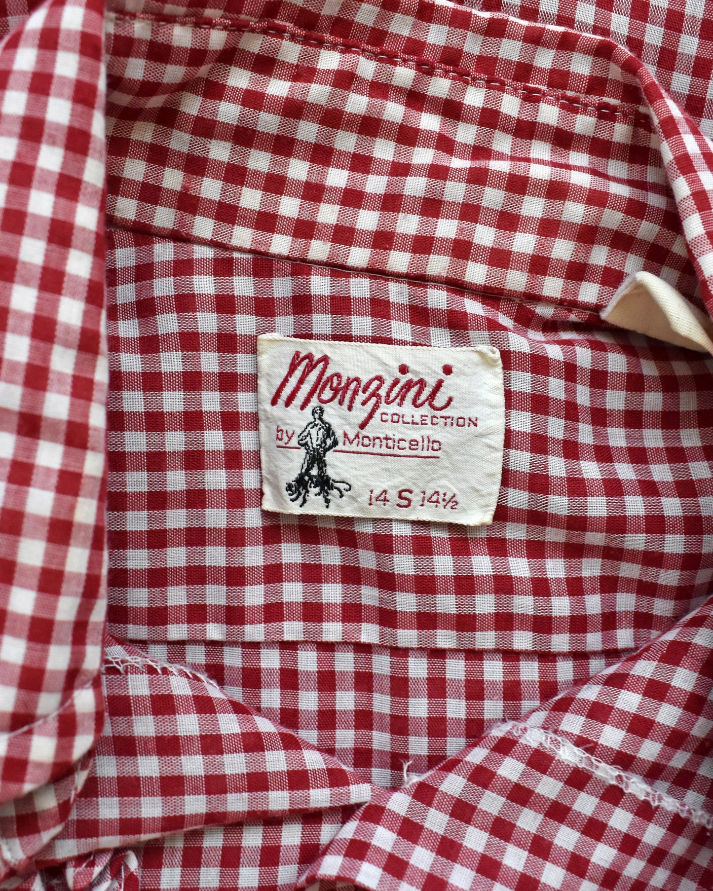 Close up of the tag which says Monzini Collection by Monticello