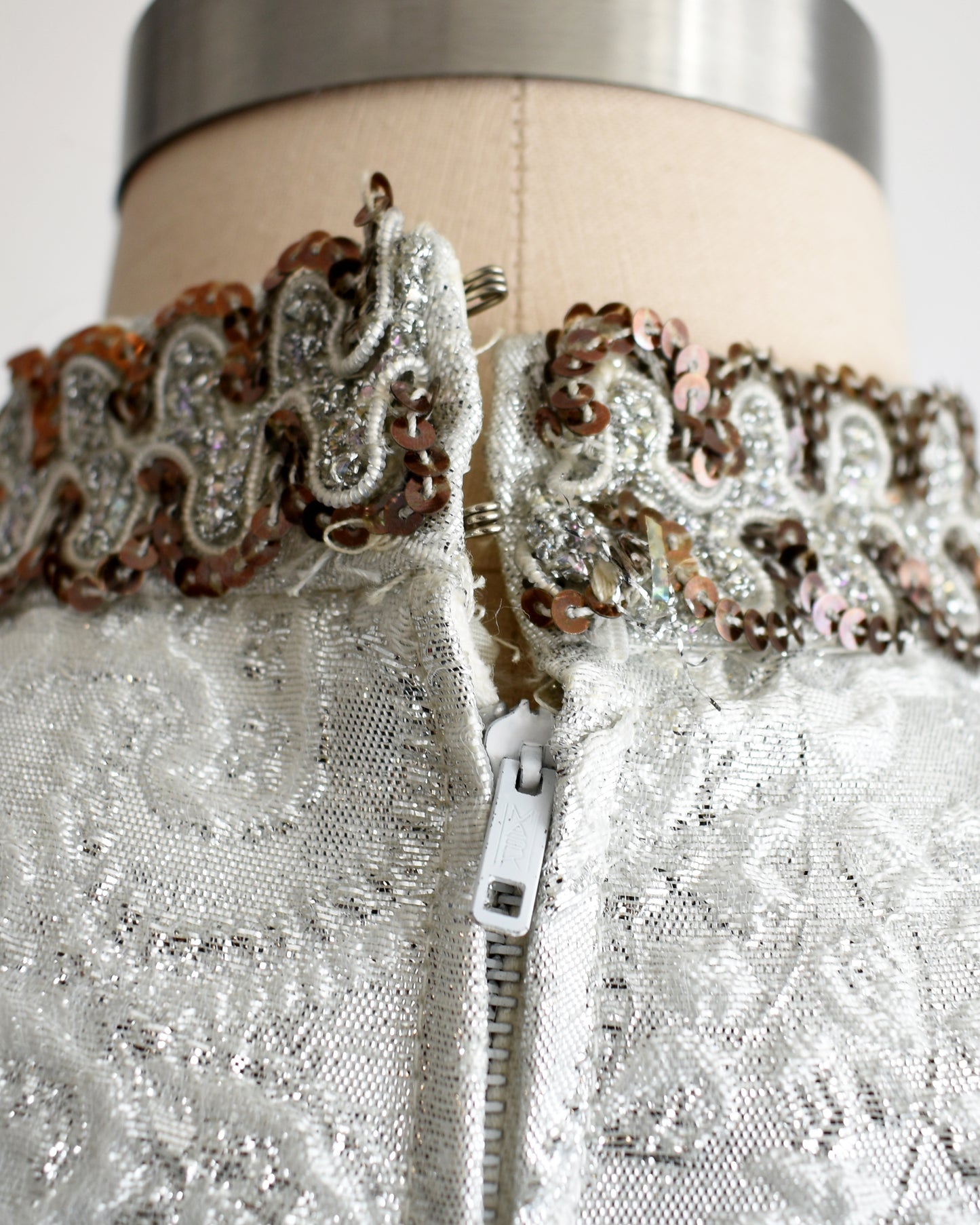 view of the hook closures on the back of the neck