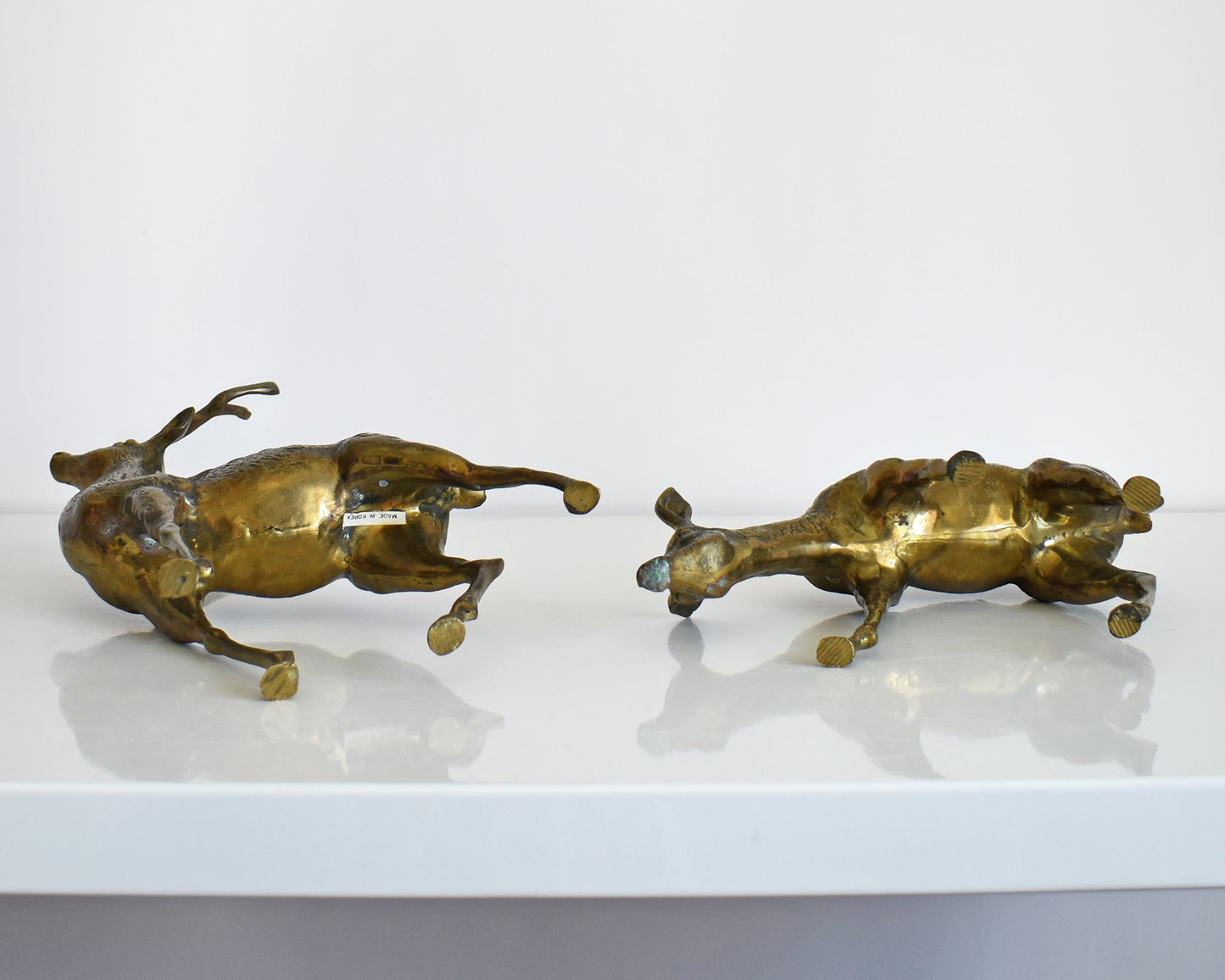 The two deers are lying down so you can see the underside.