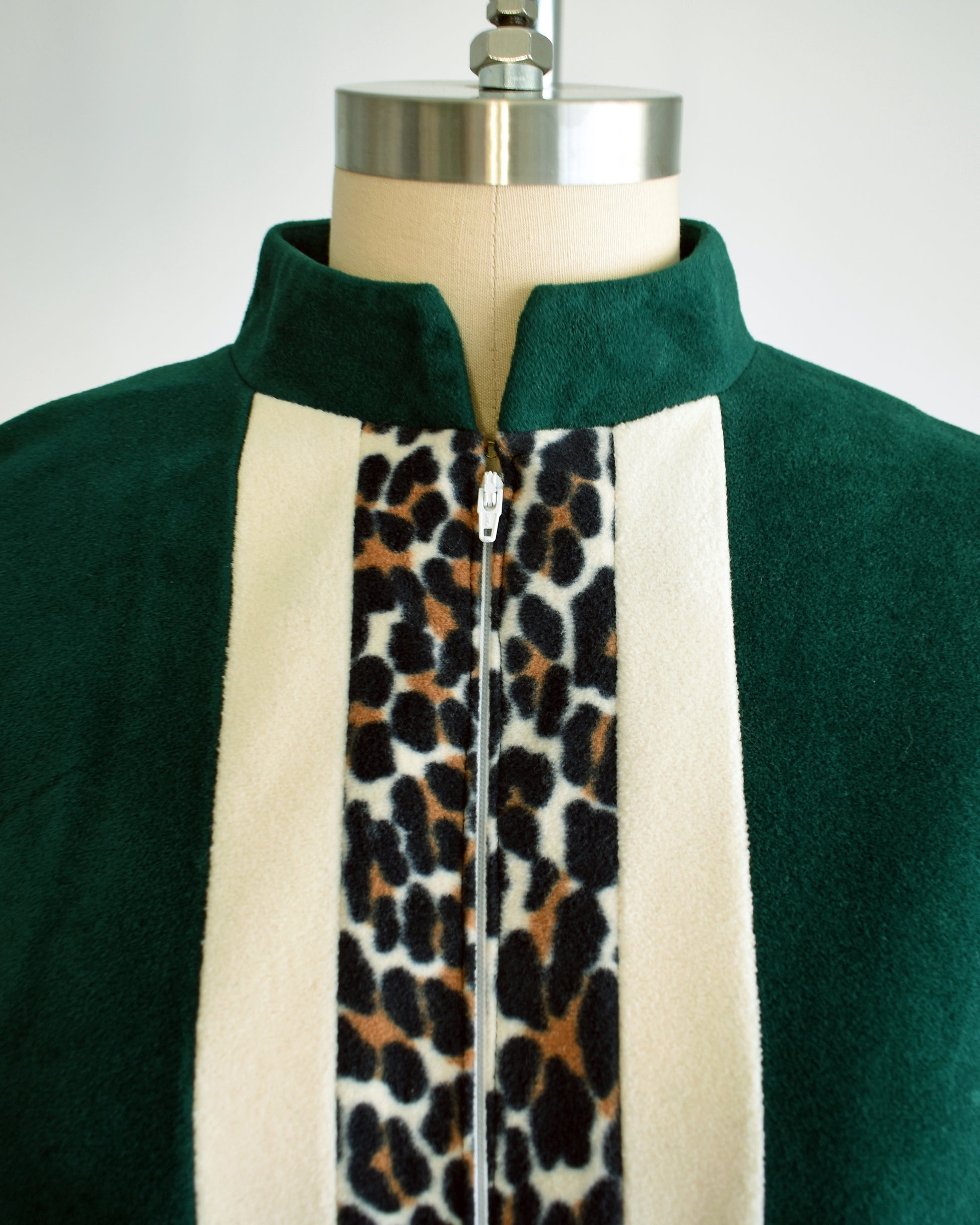 Close up of the collar, zipper, and striped front