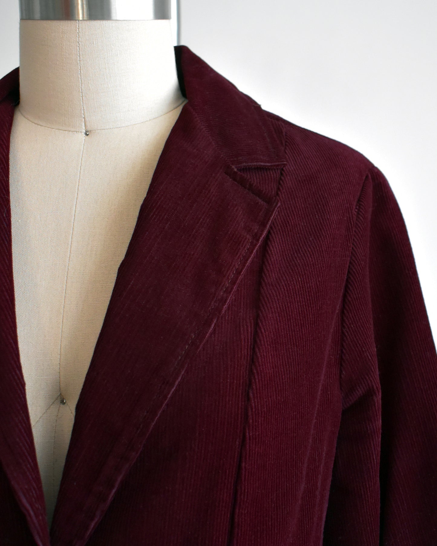 Close up of the lapel on the burgundy blazer