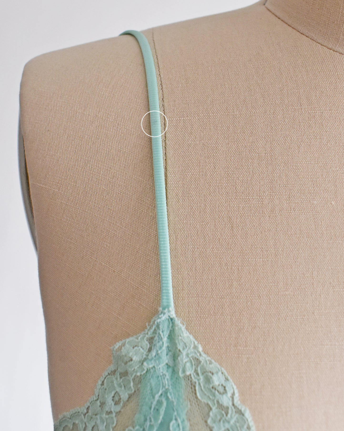 A close up of a small mark on the right strap
