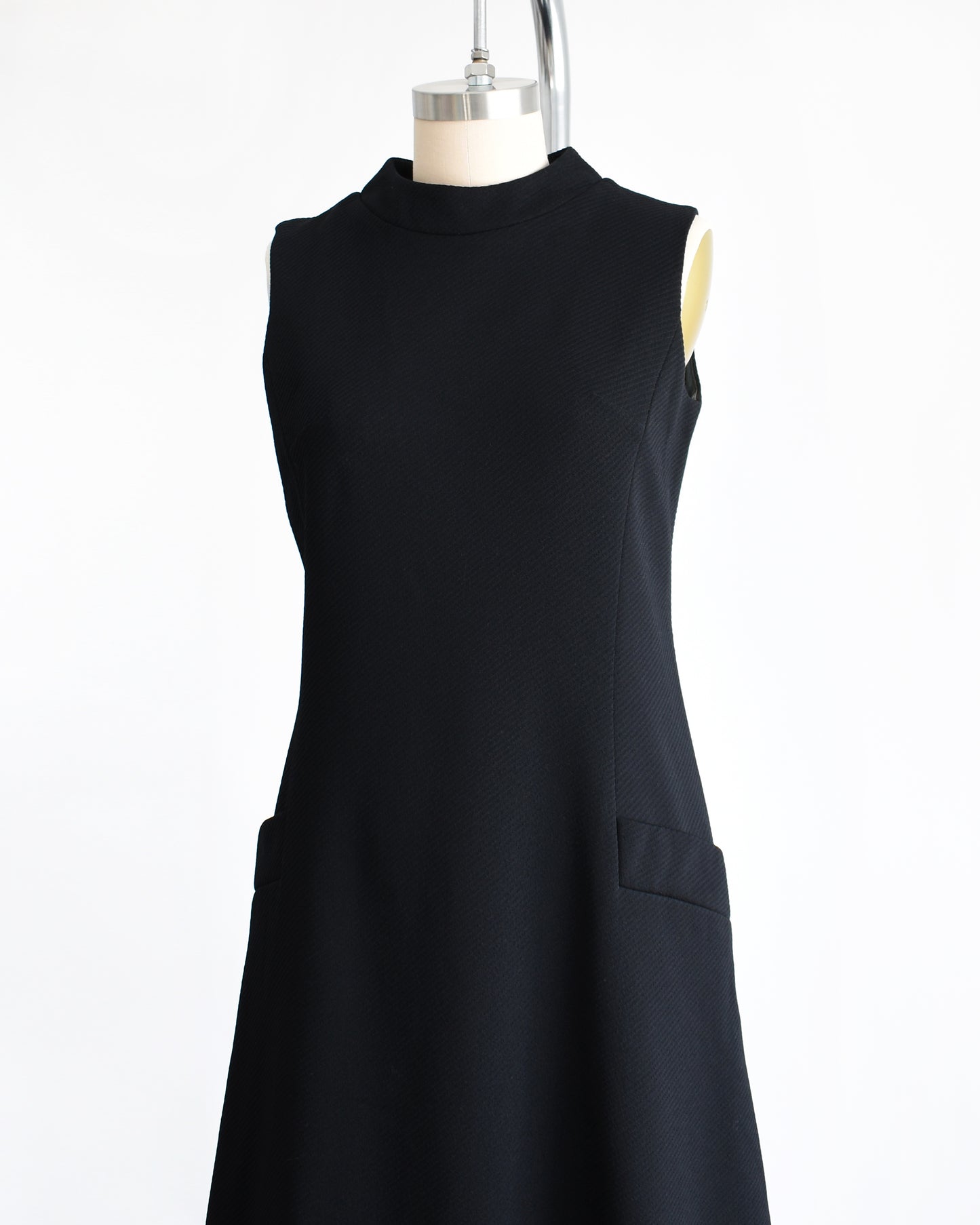 side front view of a vintage 1960s black mod scooter dress