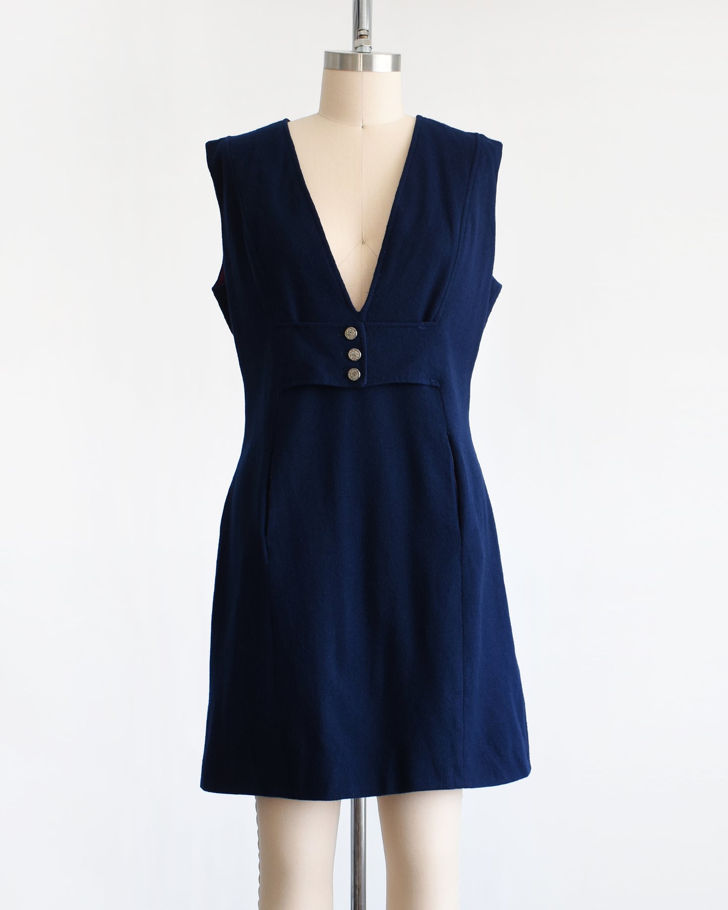 a vintage 1980s navy blue wool jumper dress