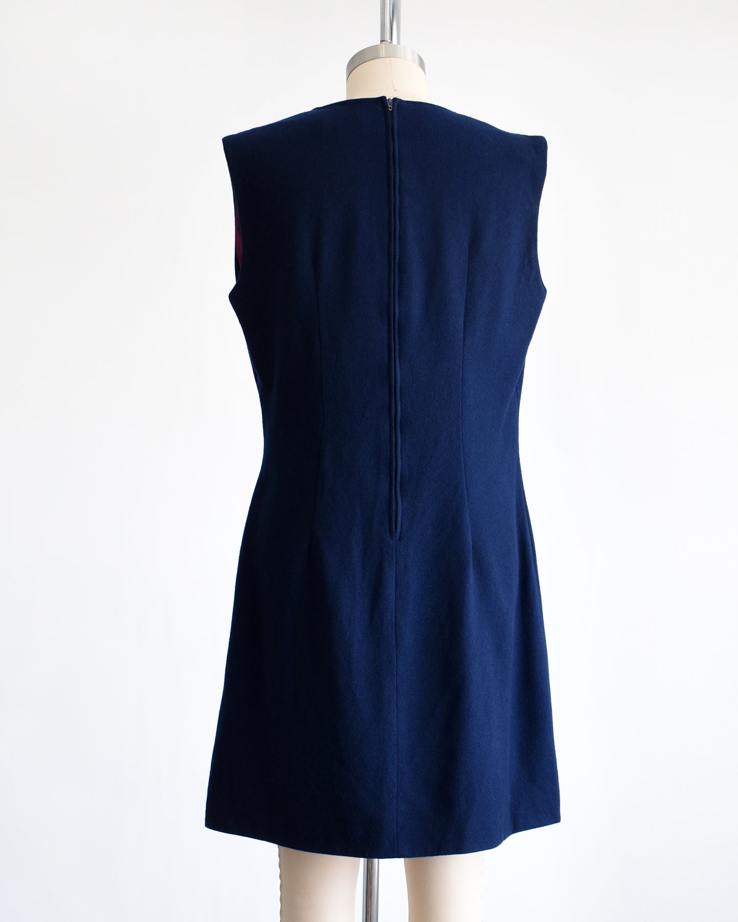 back view of a vintage 1980s navy blue wool jumper dress