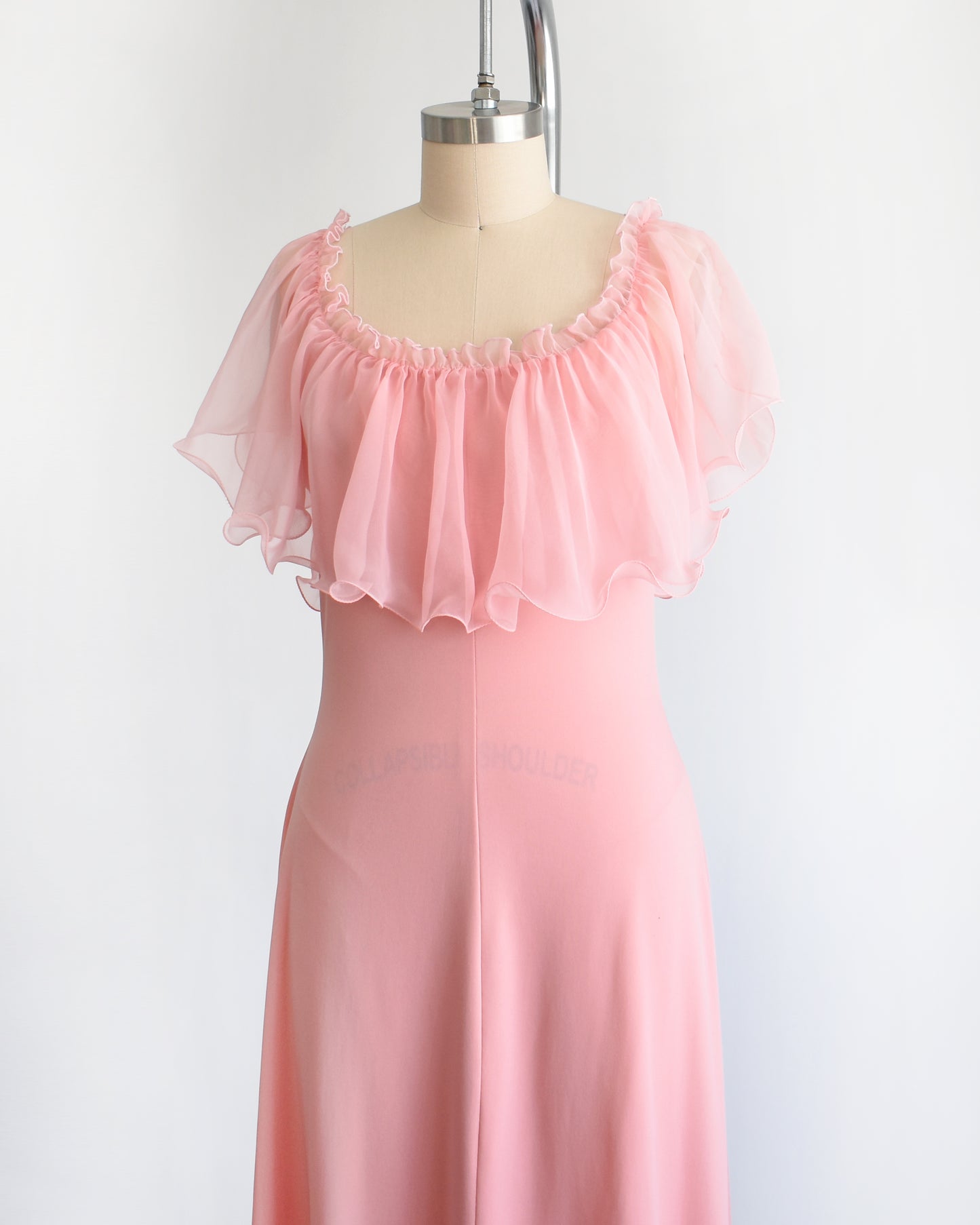 side front view of a vintage 1970s pink flutter maxi dress