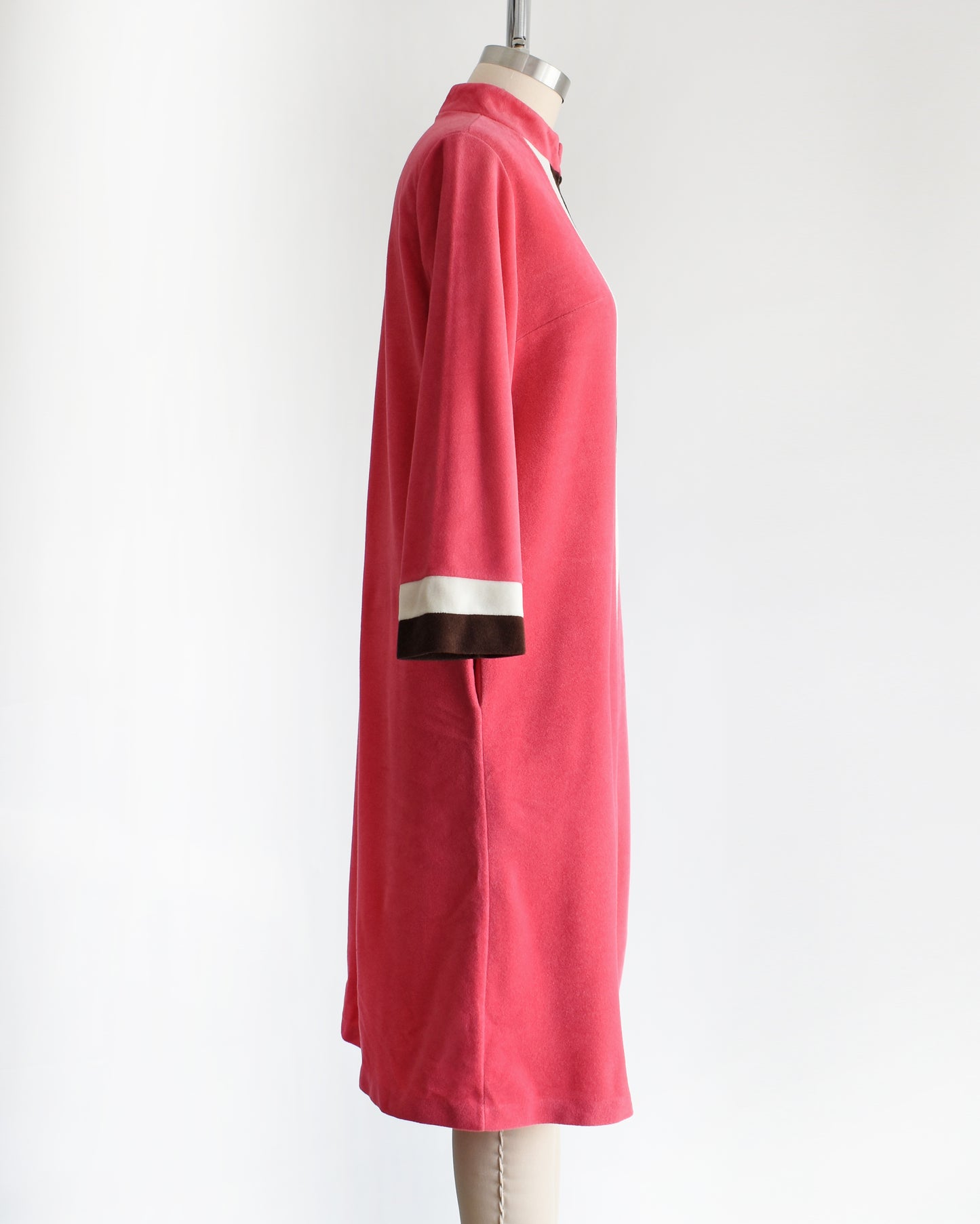 side view of a vintage 1970s pink, white, and brown striped robe by Vanity Fair