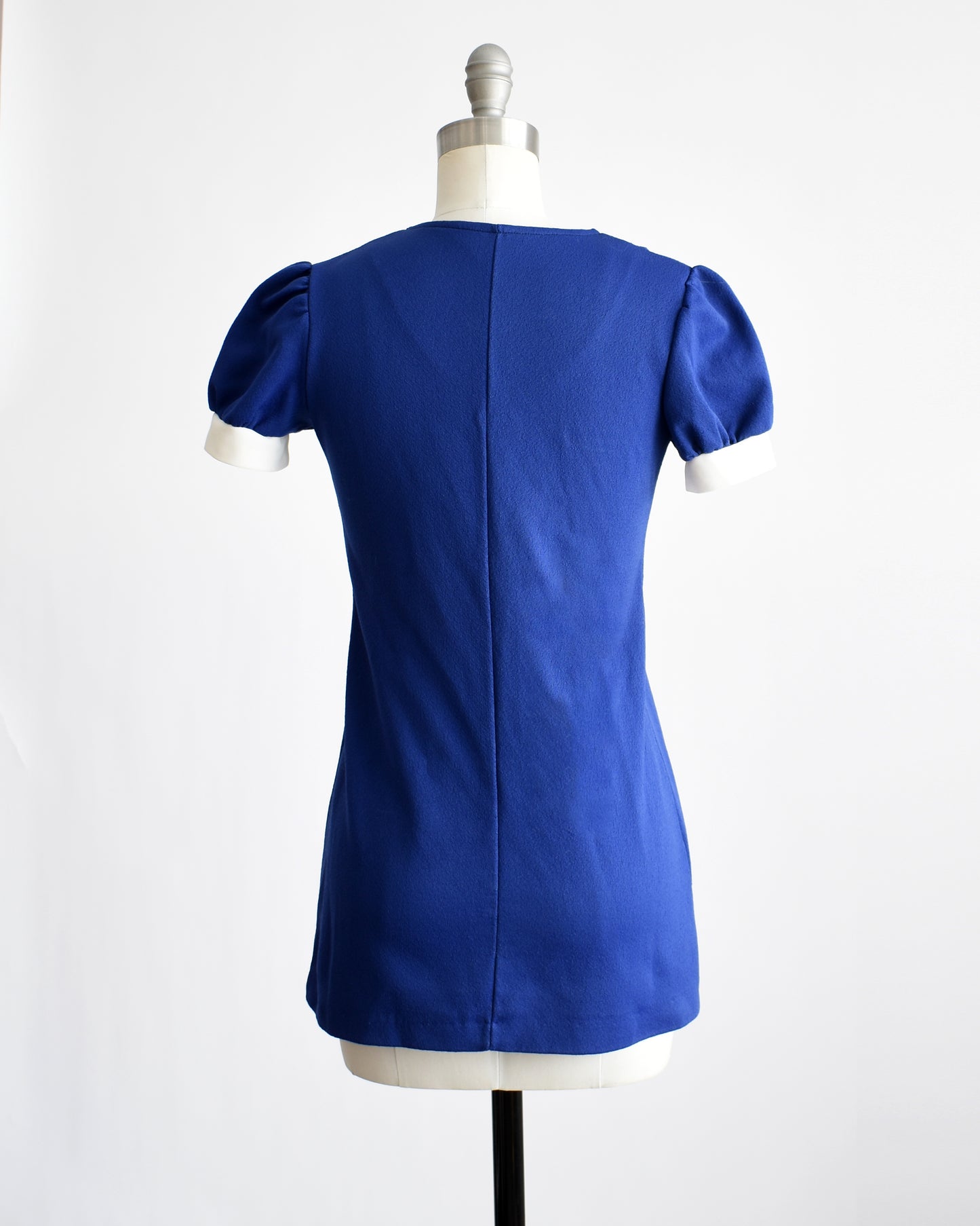 back view of a vintage late 1960s early 1970s dark blue top