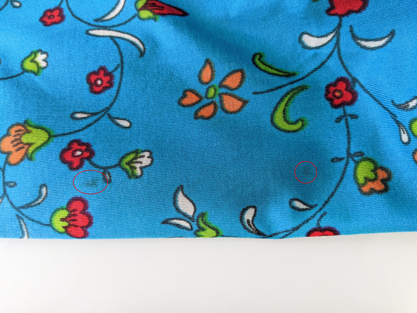 Close up of small spots on the sleeve that did not come out during cleaning.