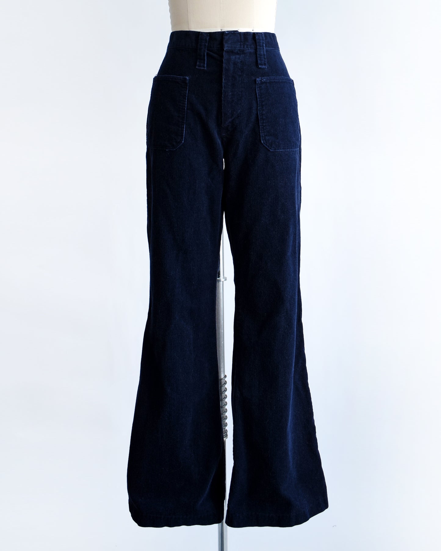 a pair of vintage 1970s navy blue corduroy bell bottoms by Lady Wrangler