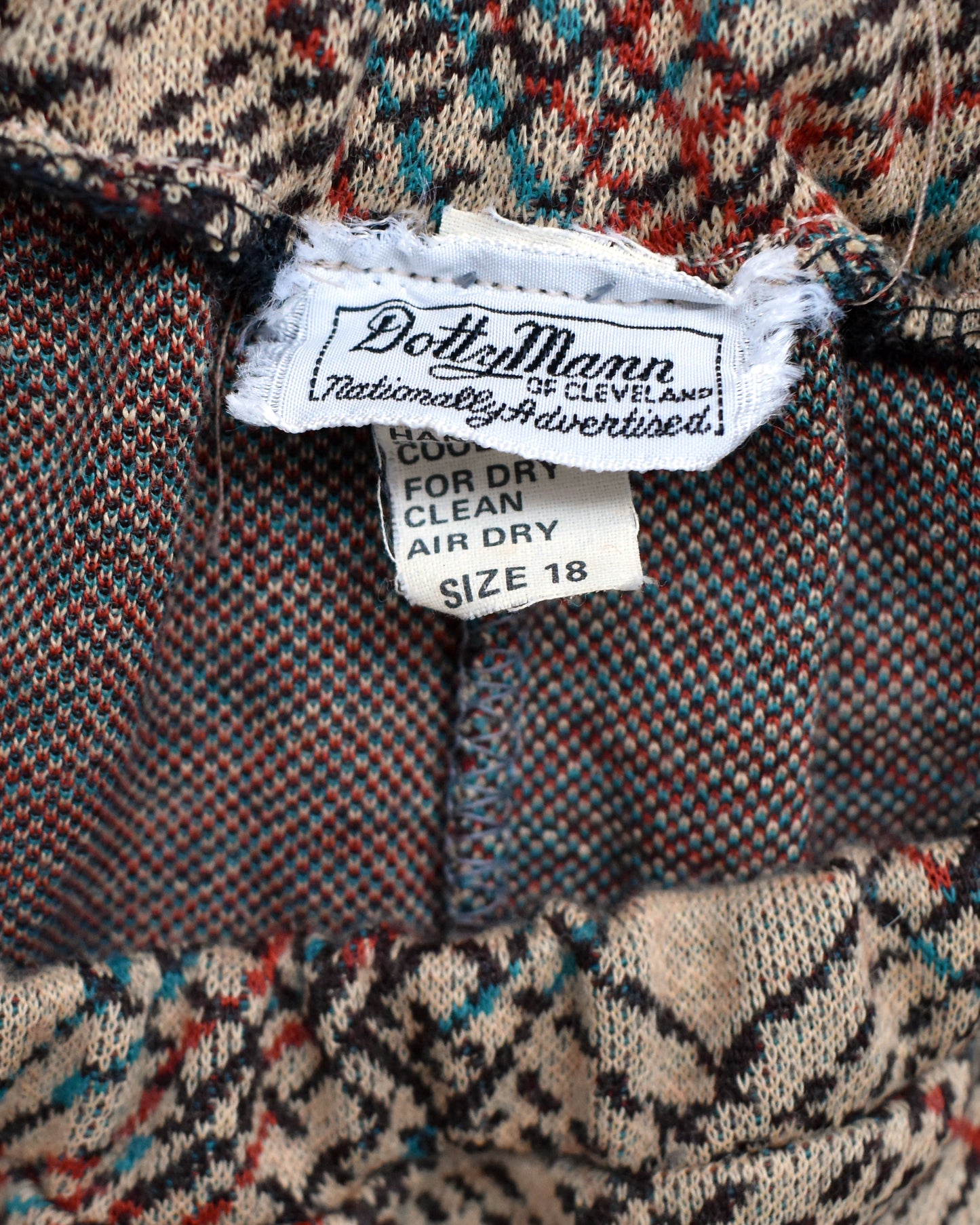 close up of the tag which says Dotty Mann of Cleveland