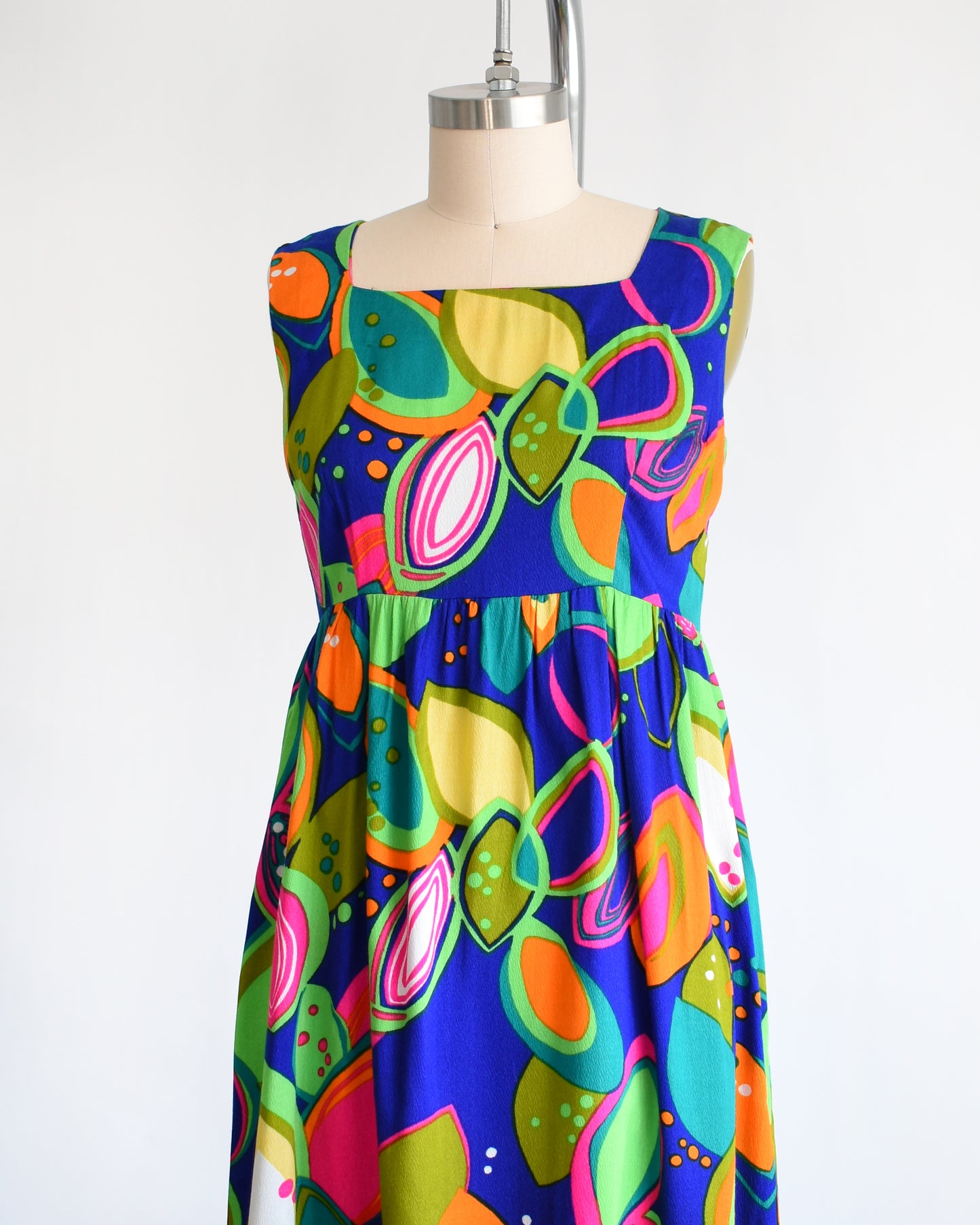 side front view of a vintage 1970s psychedelic maxi dress