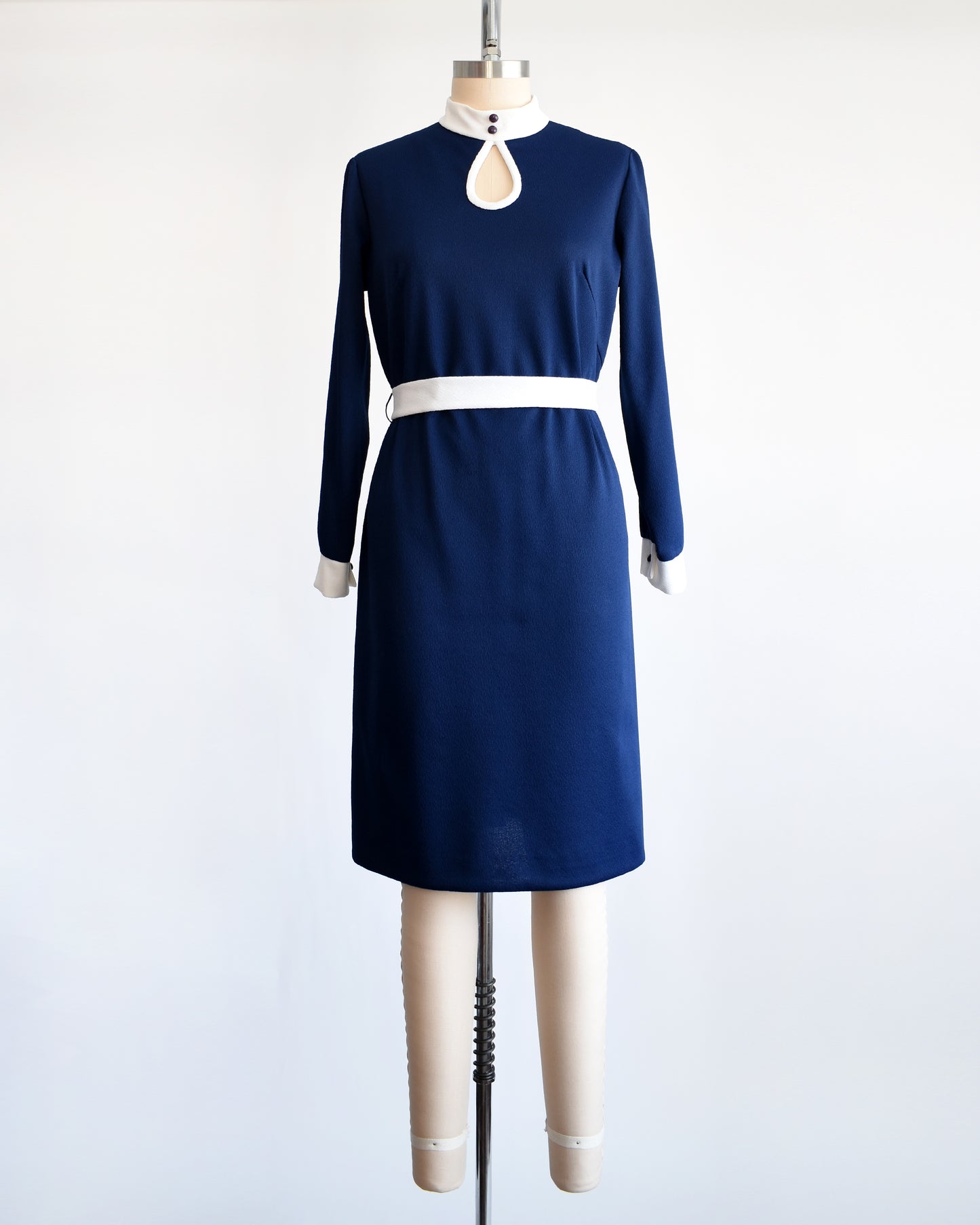 A late 1960s to early 1970s mod navy and white belted mod dress