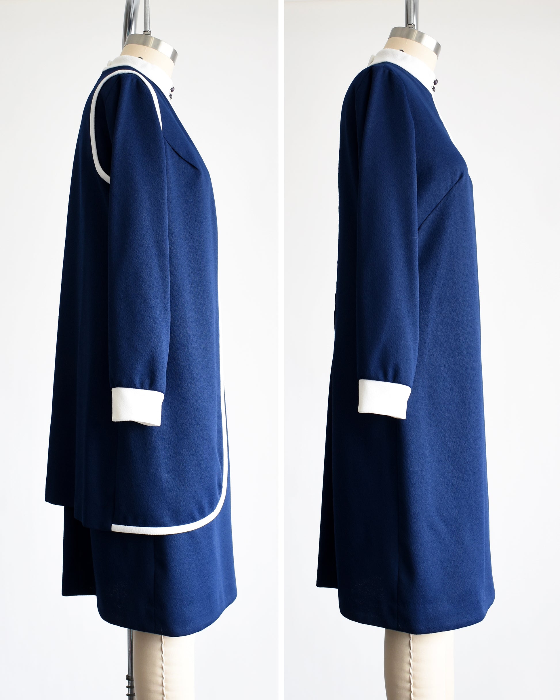 side by side side view of a late 1960s to early 1970s mod two piece set features a navy blue long sleeve dress and matching vest 