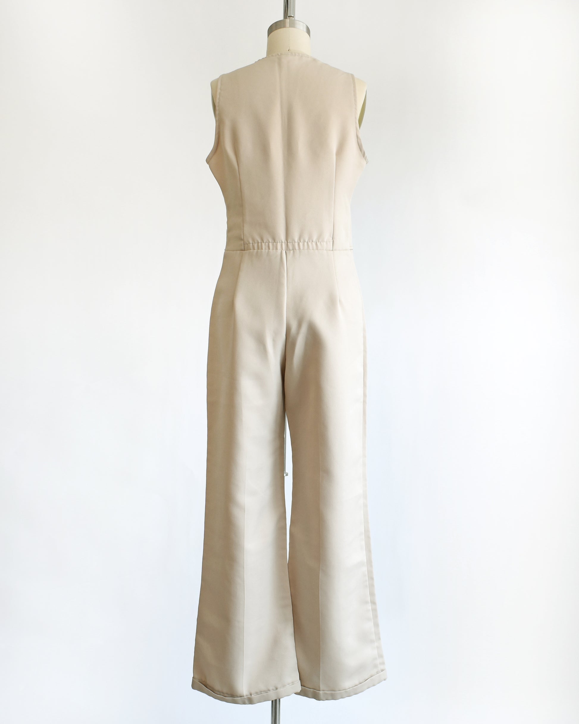 back view of a vintage 70s light tan jumpsuit