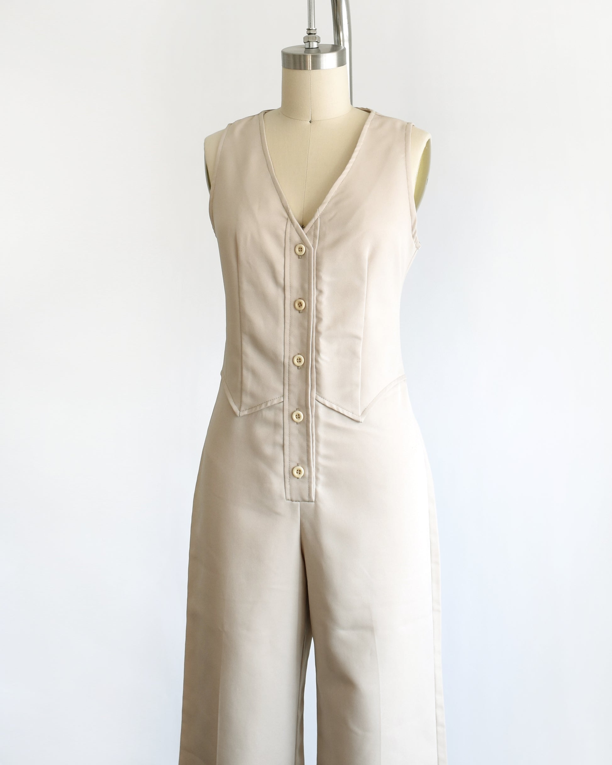 side front view of a vintage 70s light tan jumpsuit