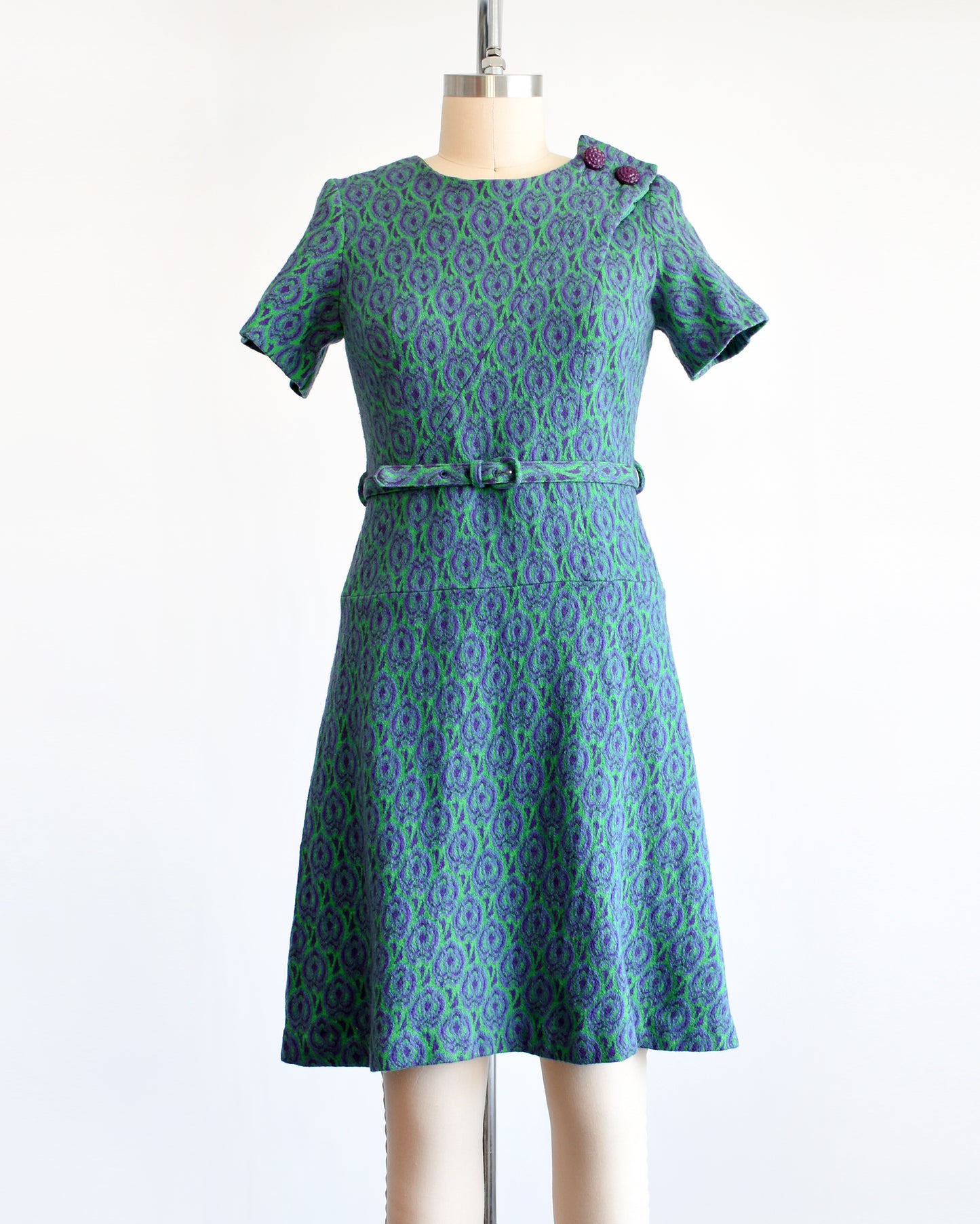 a vintage 1960s green and purple drop waist dress and matching belt