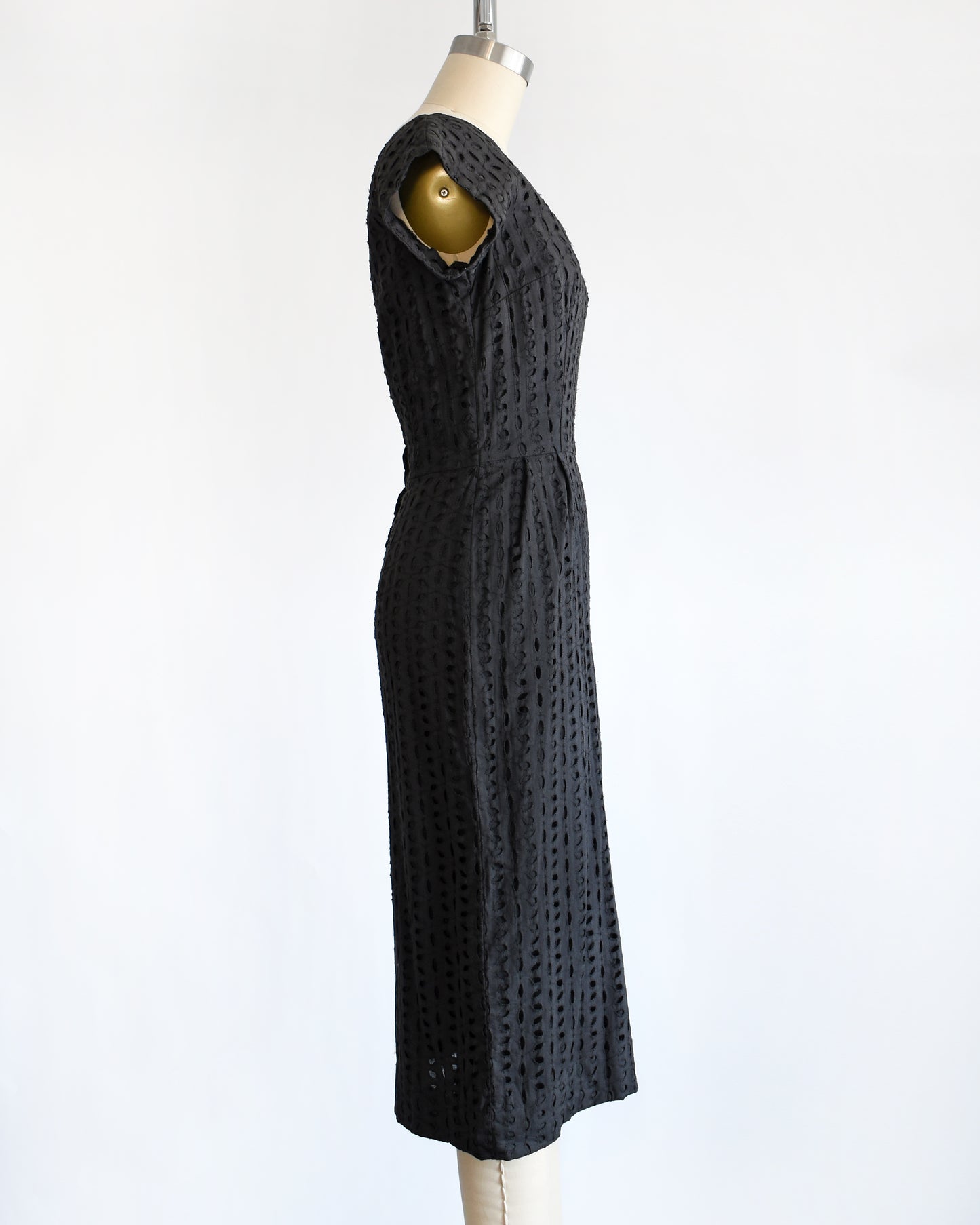 side view of vintage 1960s black eyelet dress
