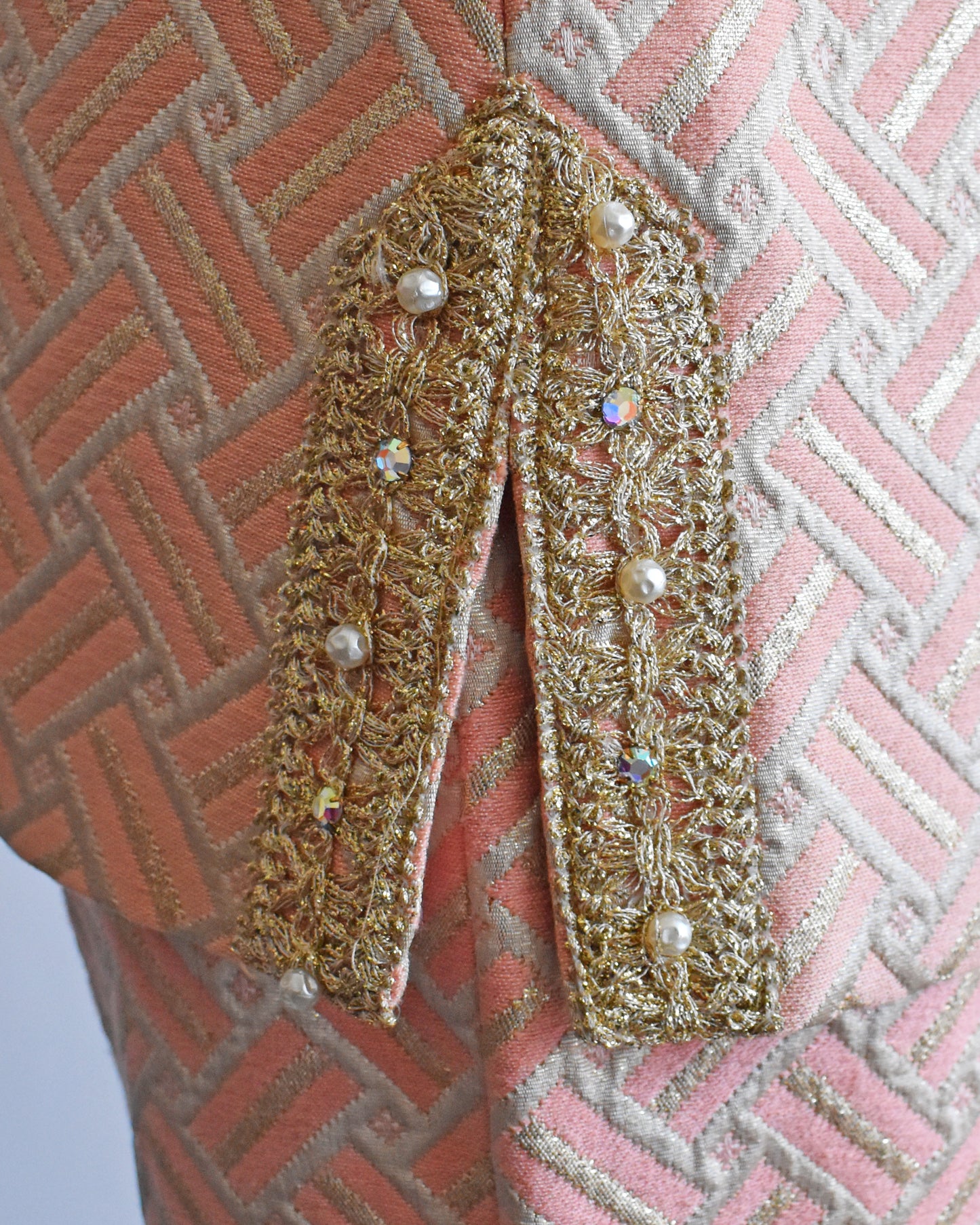 Close up of the metallic gold trim and rhinestones on the sides of the top