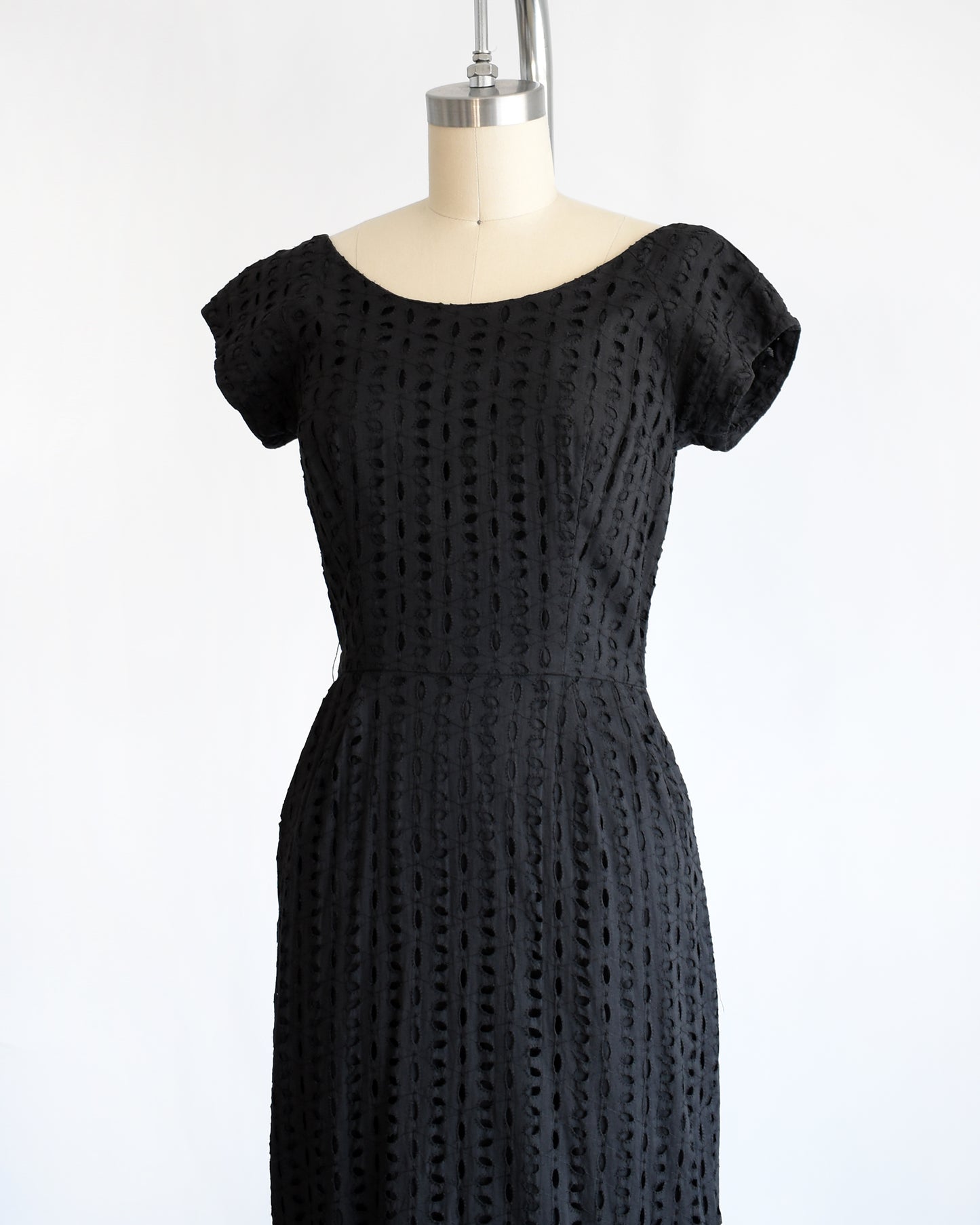 side front view of vintage 1960s black eyelet dress