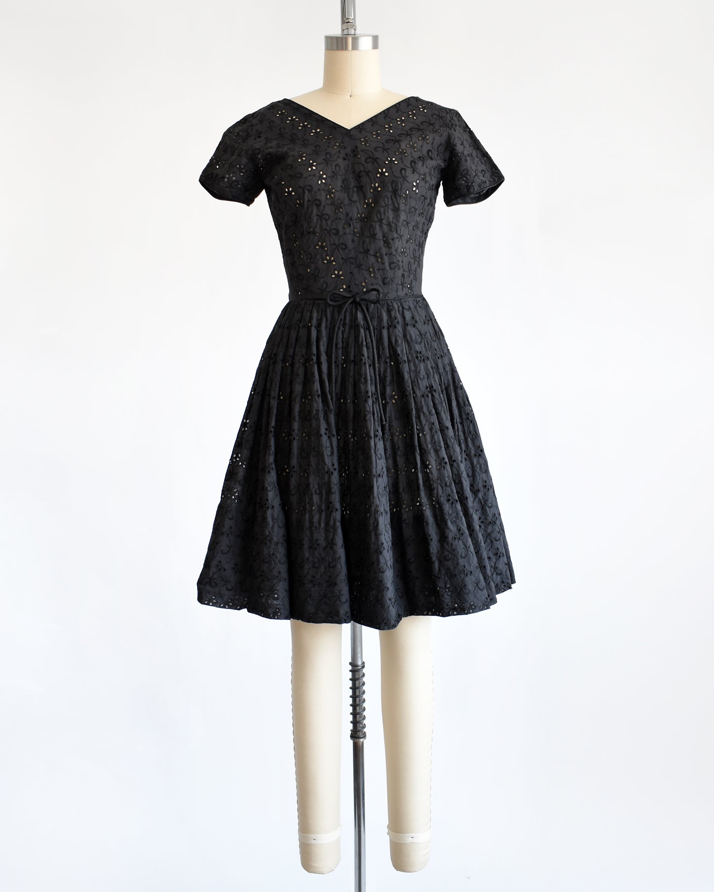 a late 1950s early 1960s vintage black eyelet dress