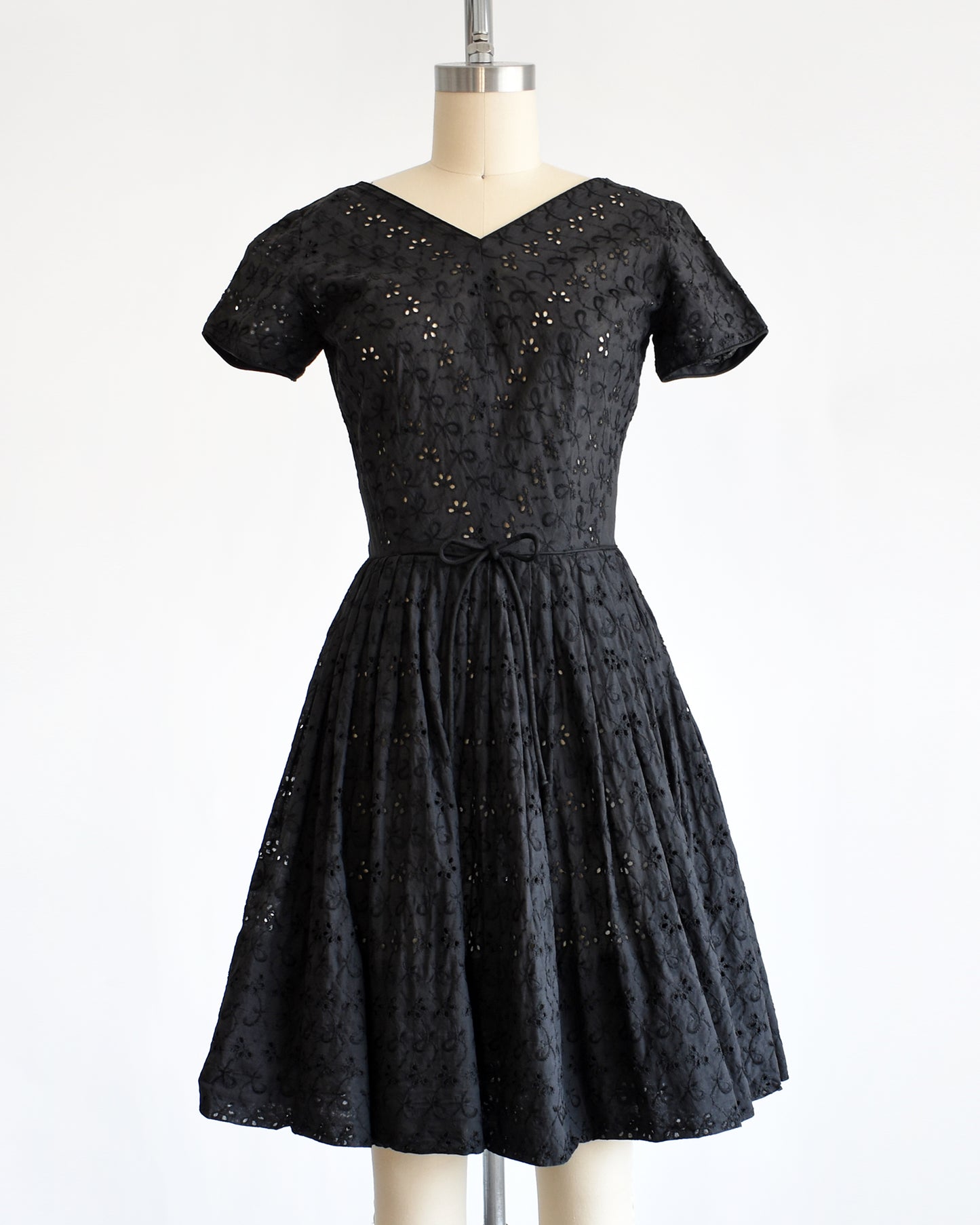 a late 1950s early 1960s vintage black eyelet dress