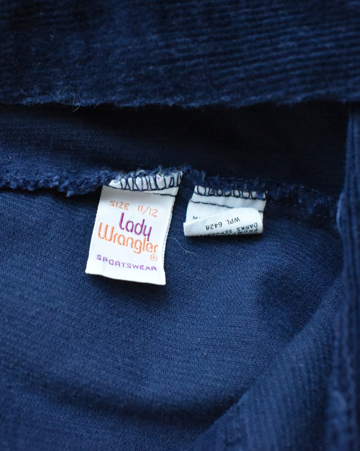 close up of the vintage tag which says lady Wrangler