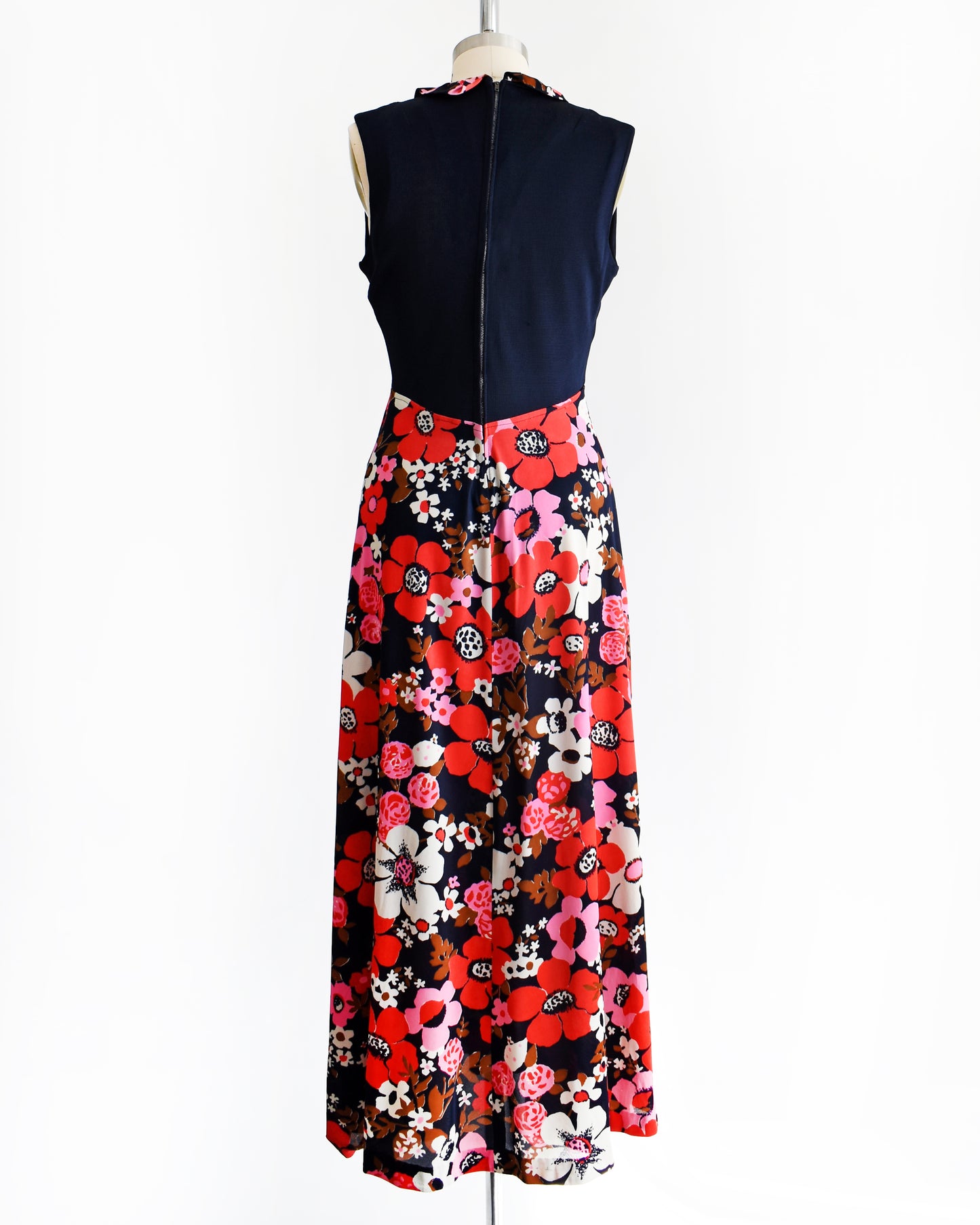 back view of a vintage 1970s navy and pink flower power maxi dress