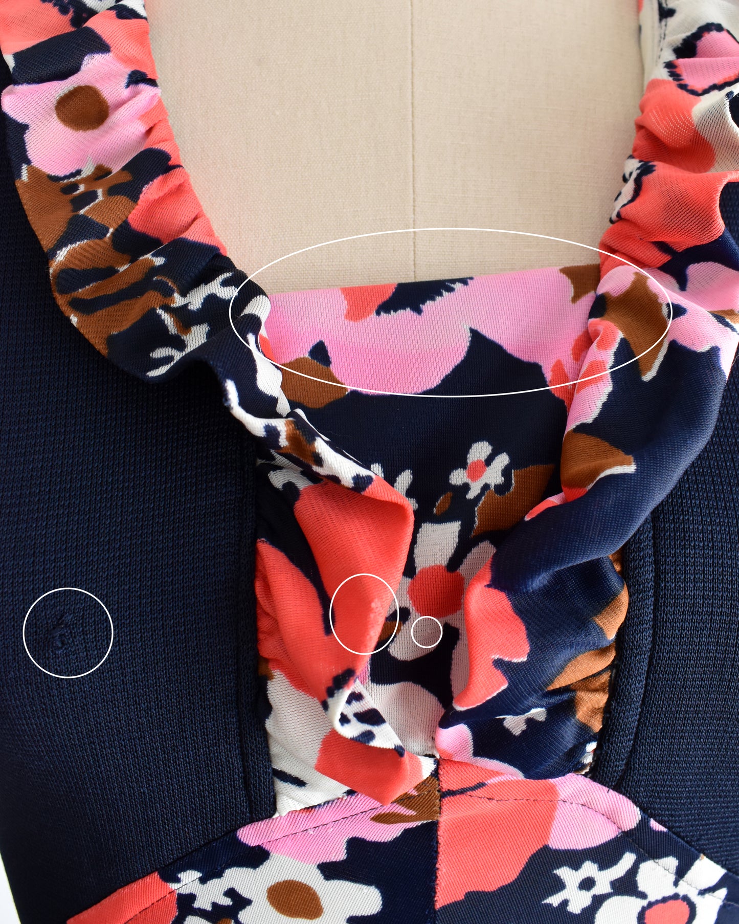 a close up of the bodice which has some flaws which include a pull and some fading on the flower print